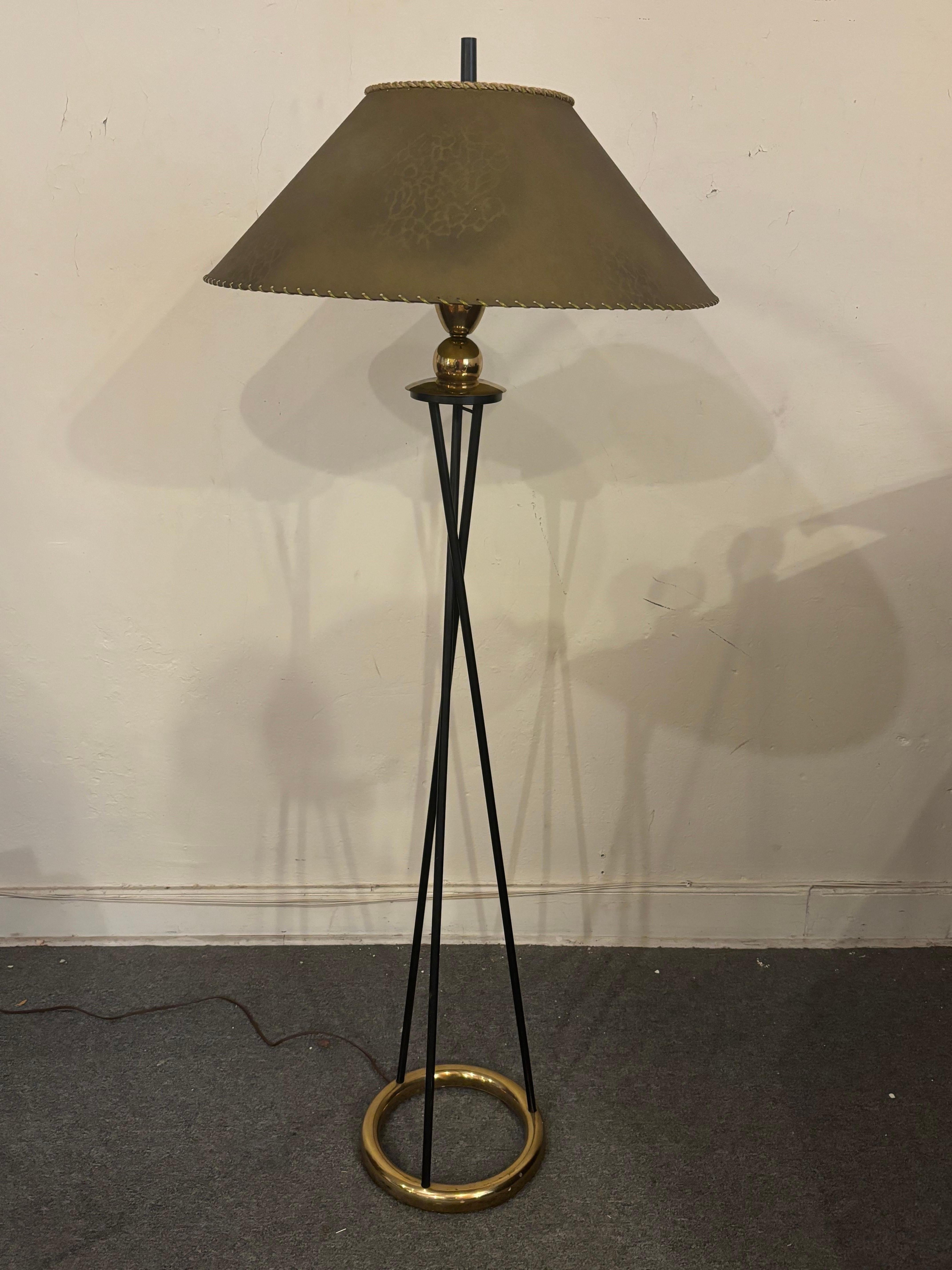 Black Floor Lamp with Brass Floor Ring.  Glass Diffuser covers the bulb and acts as the holder for the original fiberglass shade.  Lamp is a three way so throws off plenty of light!  Overall very nice original condition!