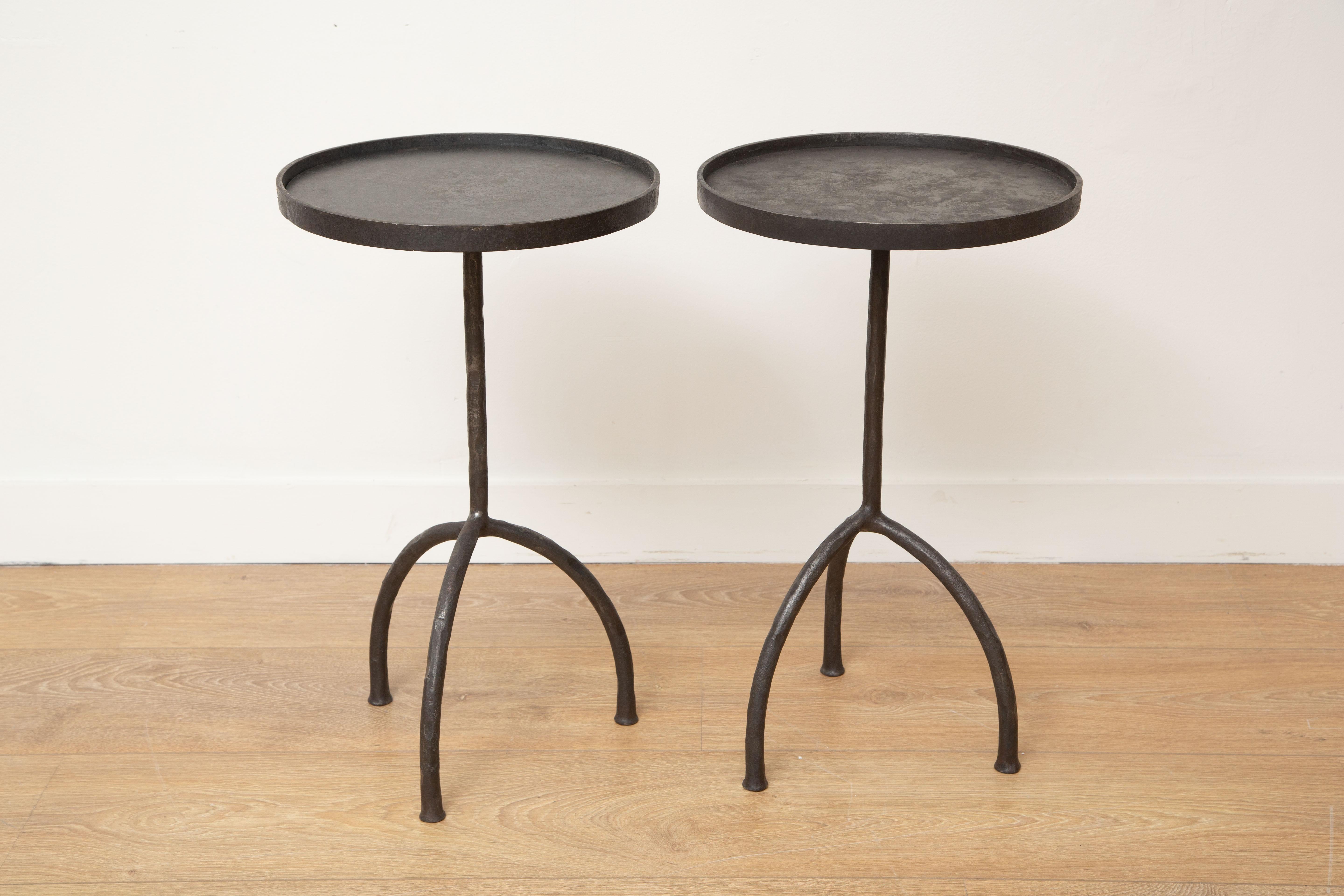 Custom tripod hand-forged side or drinks tables, in stock
Hand-forged iron legs, round top with lip
Dark bronze patina
Perfect for drinks, side, end tables
Can be sold individually (please see our listing)
Ready to ship from our showroom in Miami.
