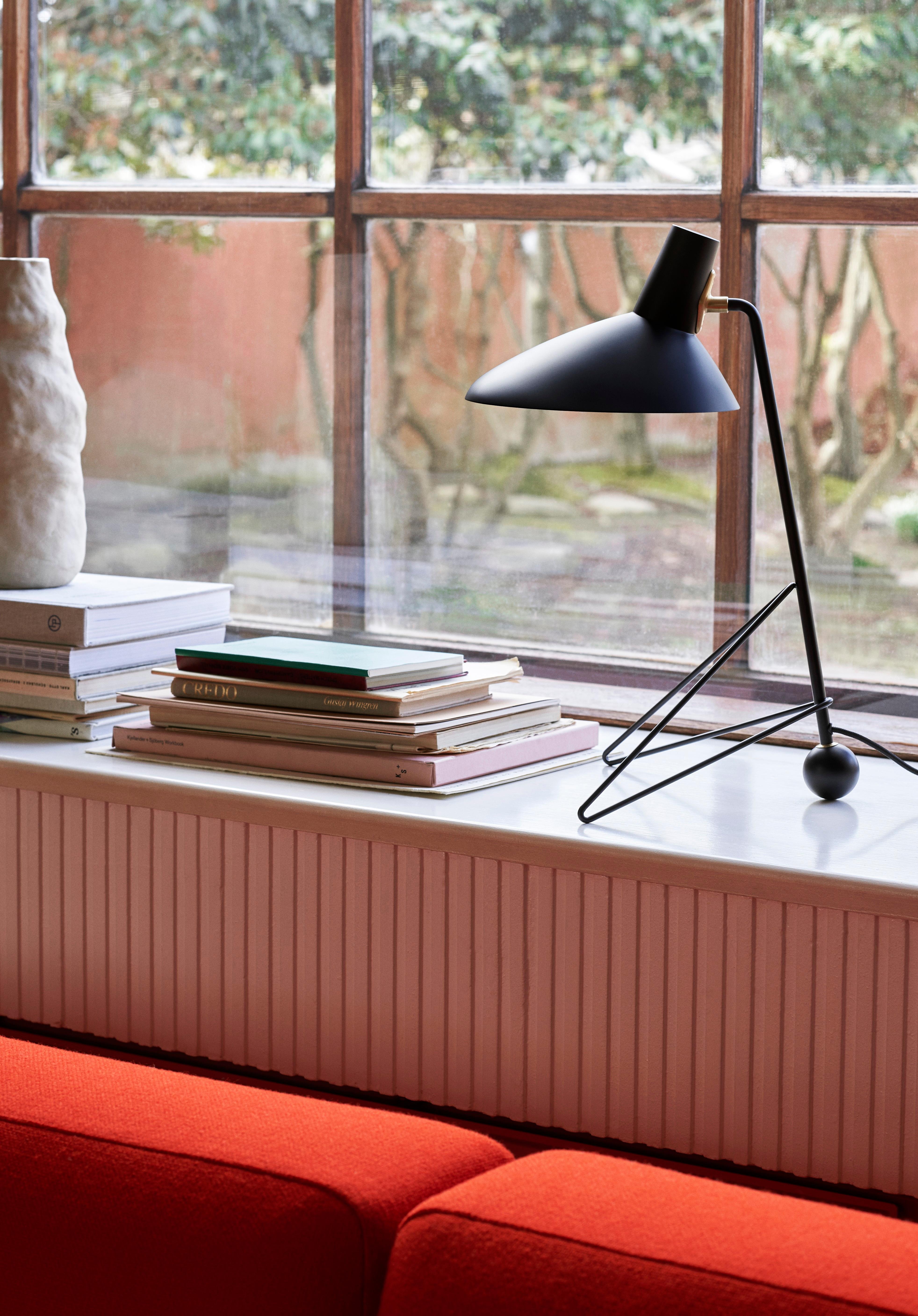 After the success of its floor lamp, &Tradition has expanded the Tripod series to include a table lamp with the same timeless design. 
Tripod, a table lamp built from powder-coated steel with brass details, reflects the clean minimalism of the