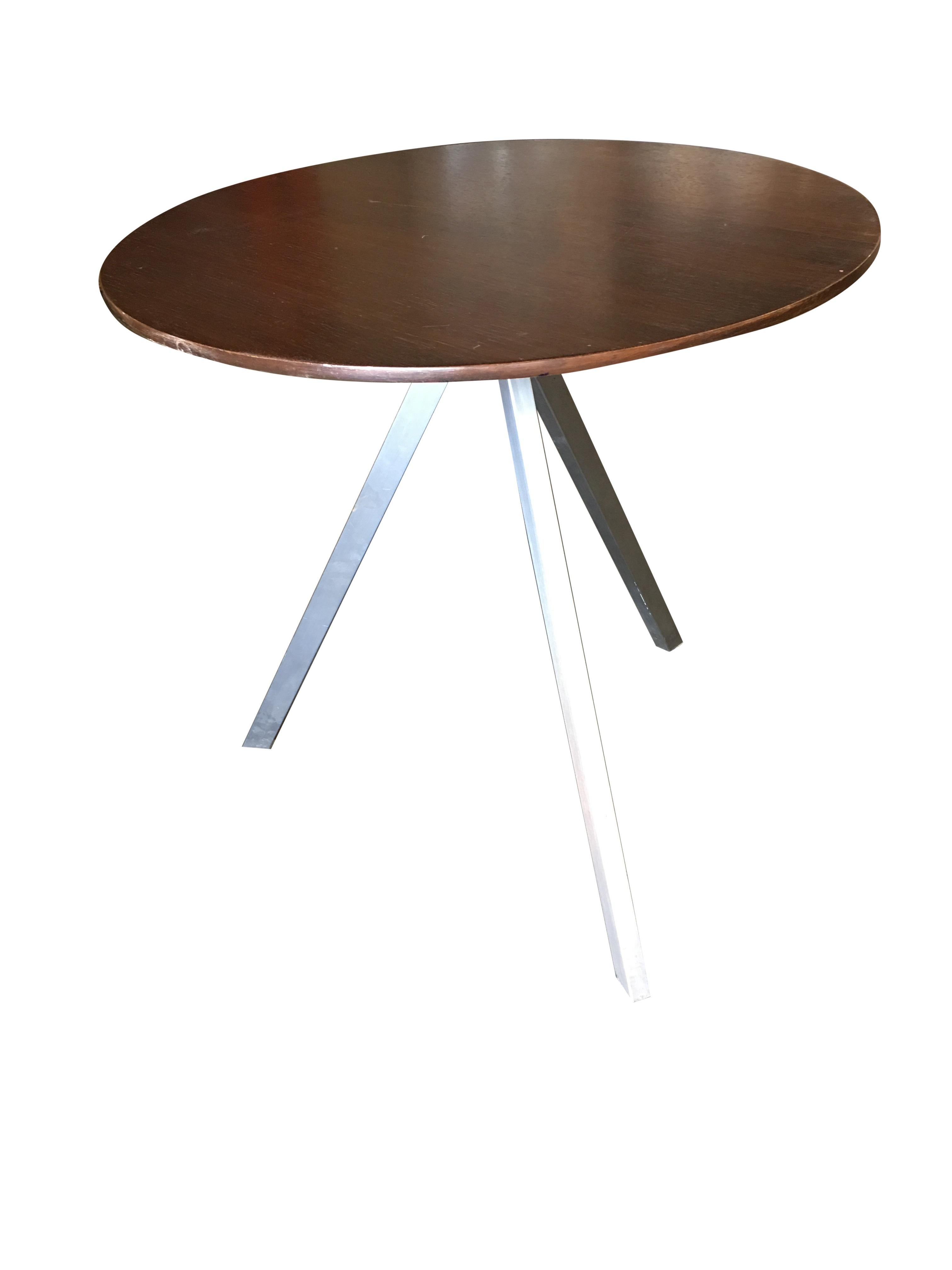 Large tripod leg coffee table featuring a dark stained oak top and a silver powder-coated 