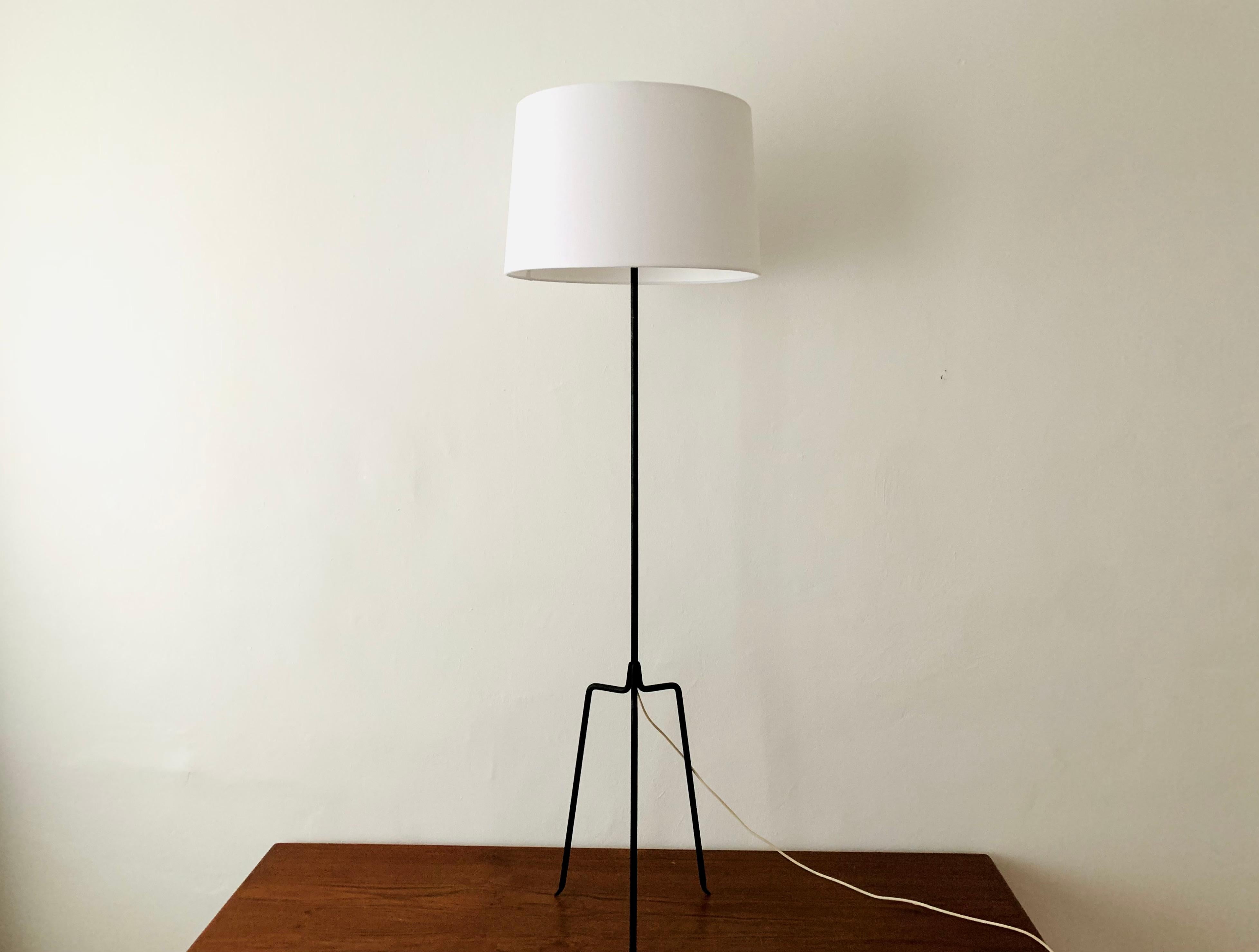 Very beautiful and elegant floor lamp from the 1950s.
Wonderful and contemporary design.
A highlight for every room.

Condition:

Very good vintage condition with minimal signs of wear consistent with age.
The frame was repainted
The