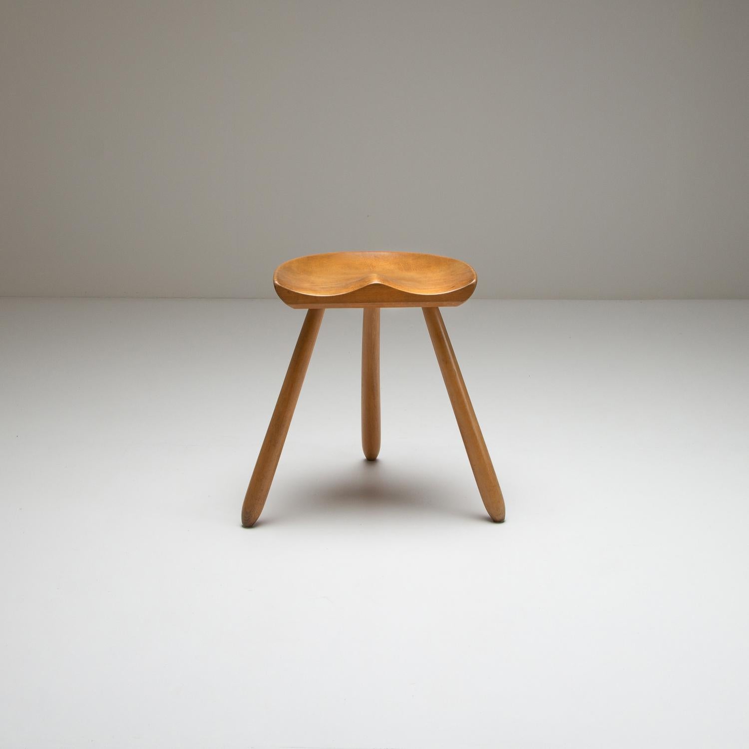 The iconic Danish tripod milking stool in solid beech, 1950s. Sensitively restored. Beautiful patina. Rock solid.