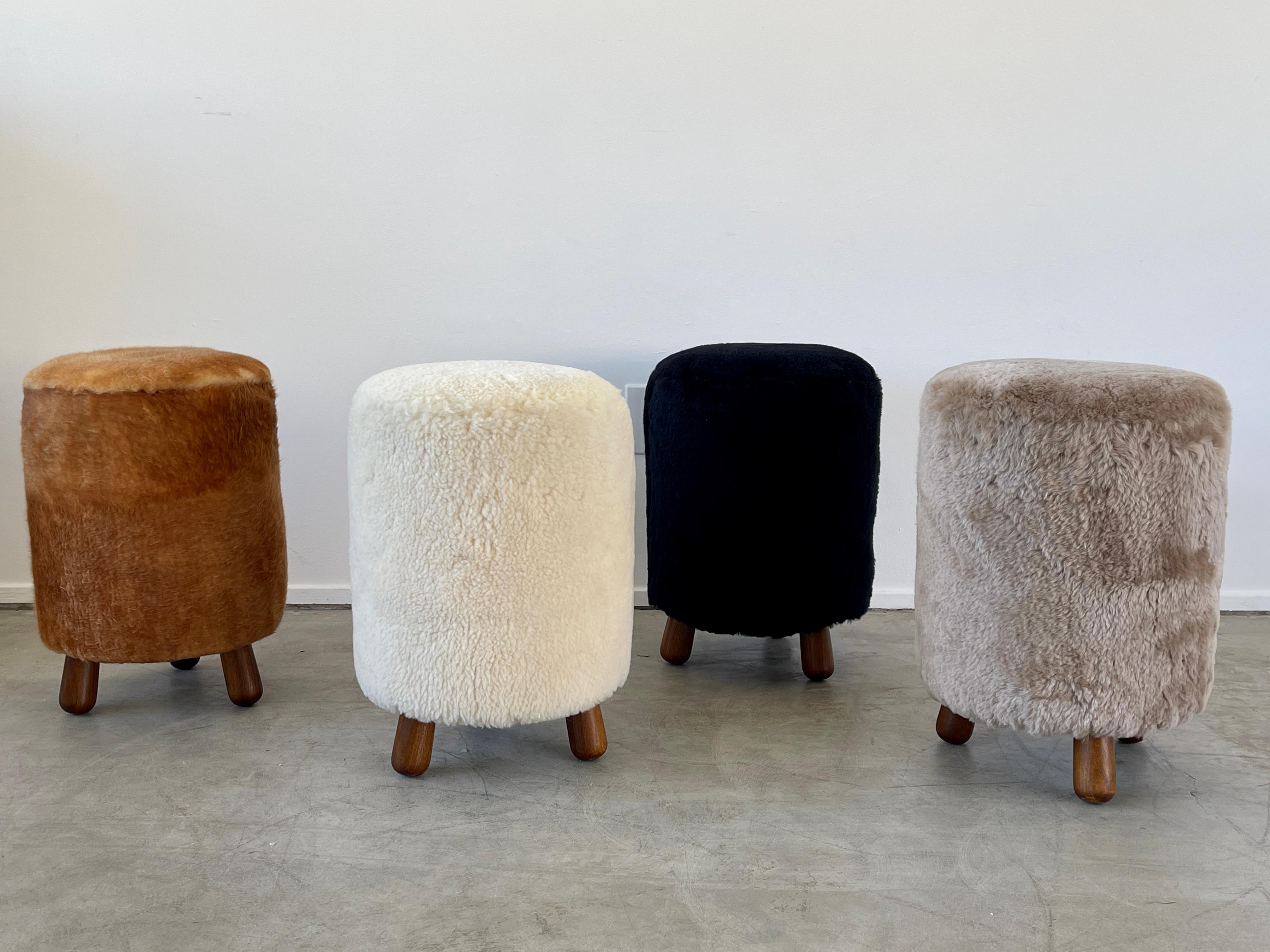 Great shaped stools with Royère style tripod legs.
Reupholstered in sheepskin - 
Priced individually.