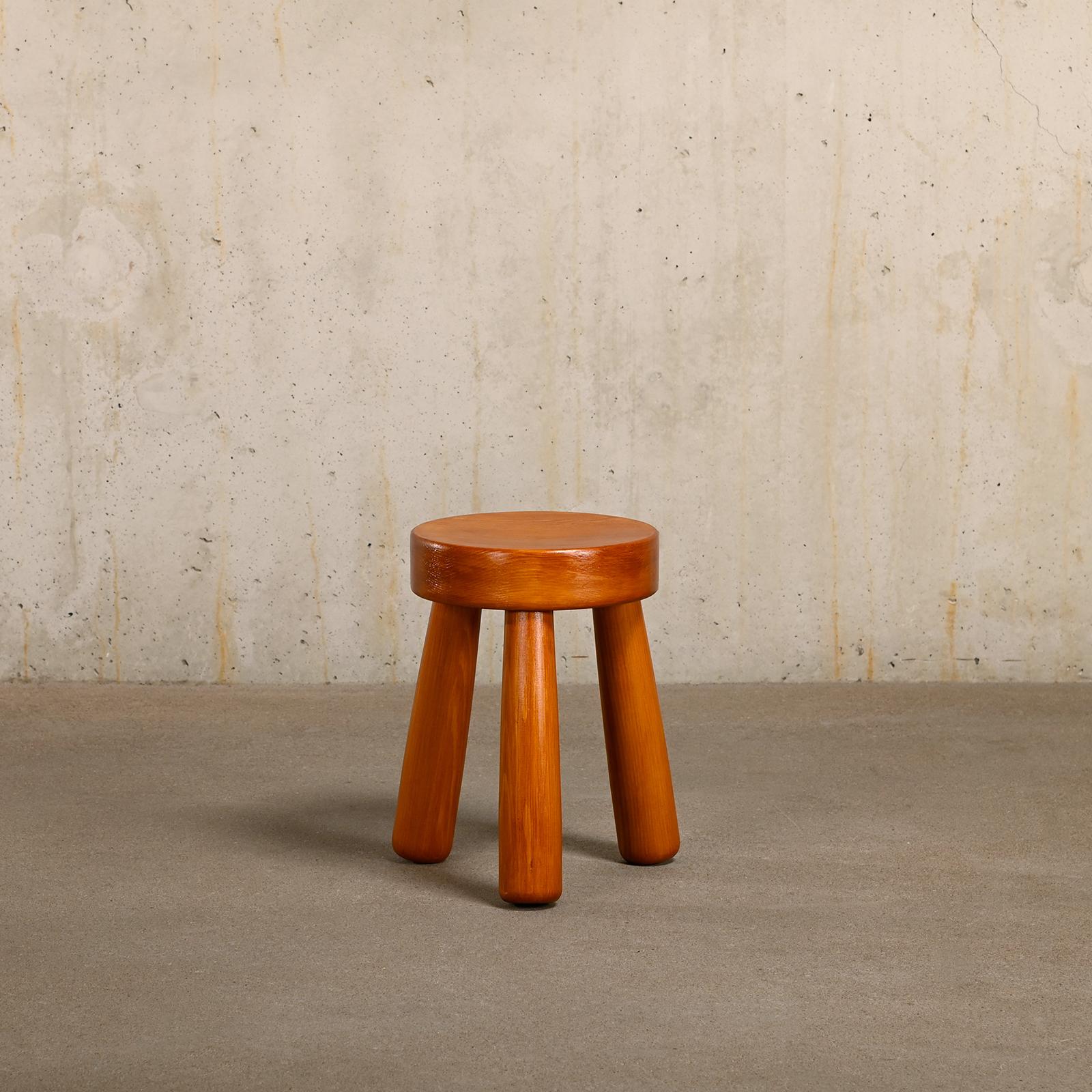 Beautiful Tripod Stool designed in the manner of Ingvar Hildingsson, Sweden. Solid pine wood and finished with a clear lacquer. The stool is in very good condition and stamped with Gröning Design - Bergsjö Sweden.