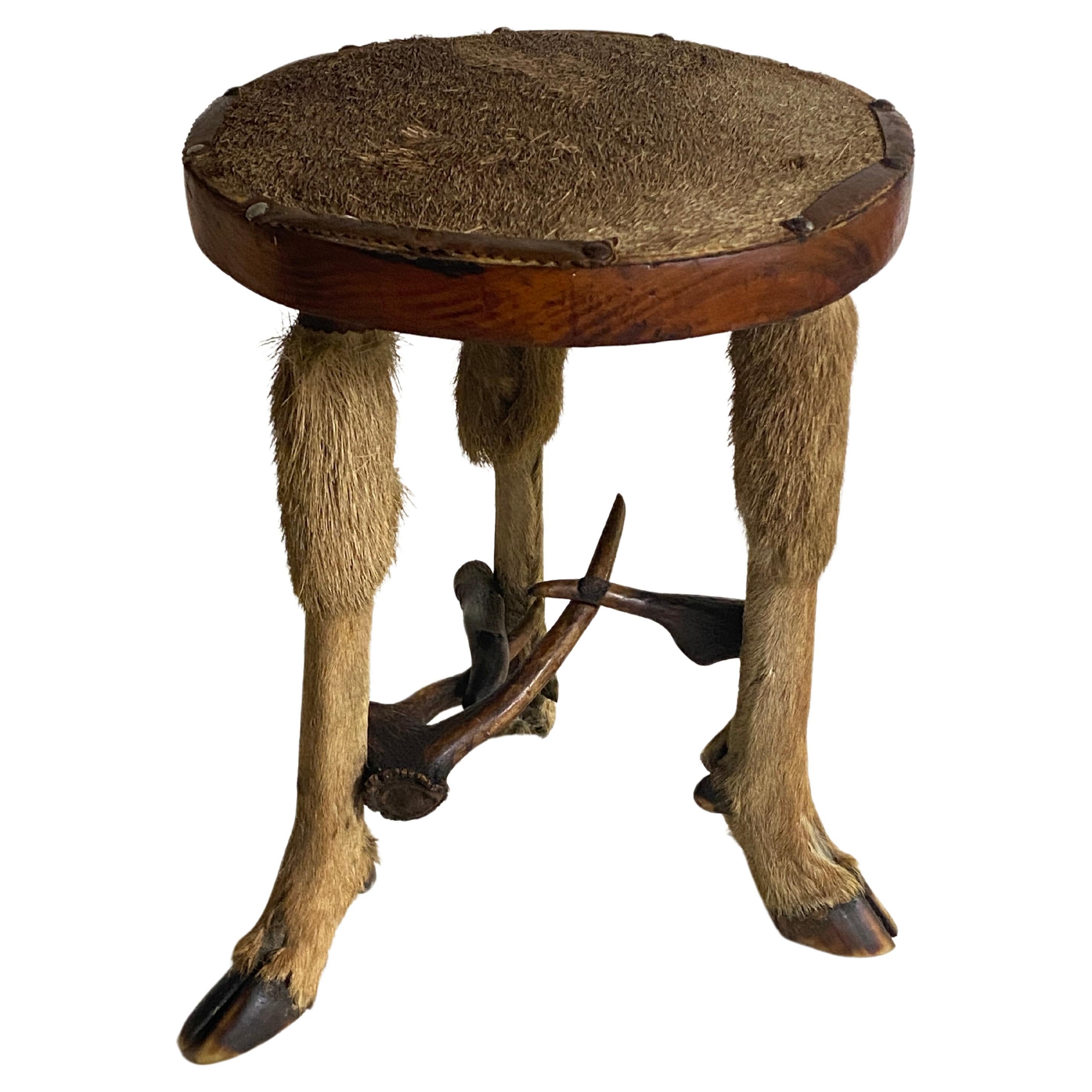 A stool with a doe leather, wood and horn.
Mountain Style.
France 1970.