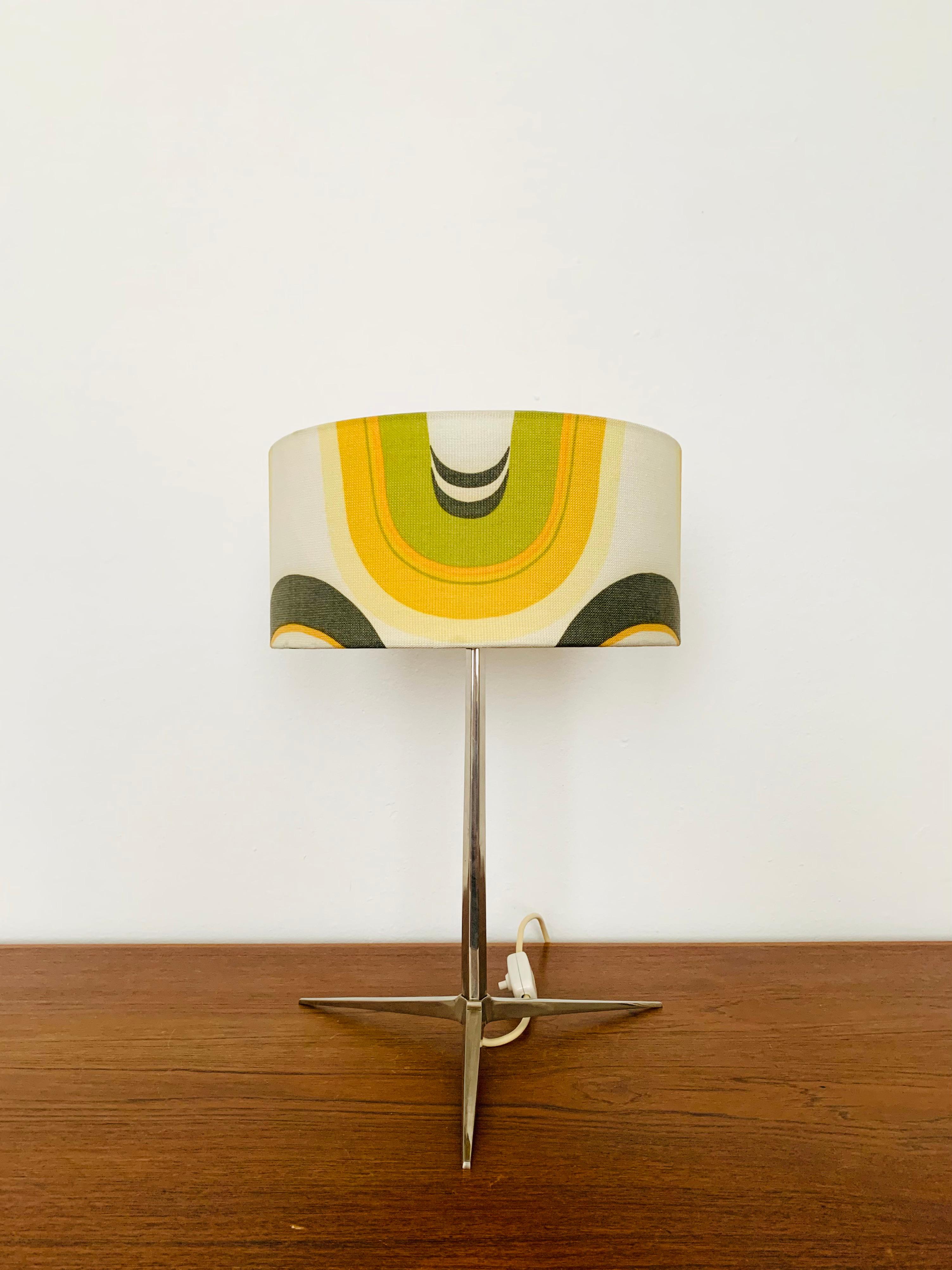 Very elegant table lamp from the 1960s.
Great design and high-quality workmanship.
The loving details and the very pleasant lighting effect make the lamp special and a real favorite.

Condition:

Very good vintage condition with slight signs