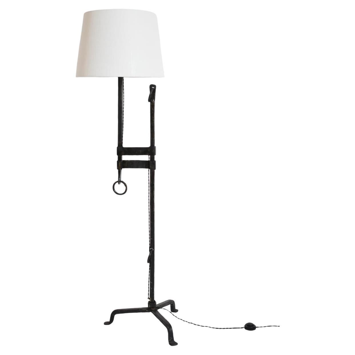 Tripod wrought iron adjustable floor lamp, 1950s.