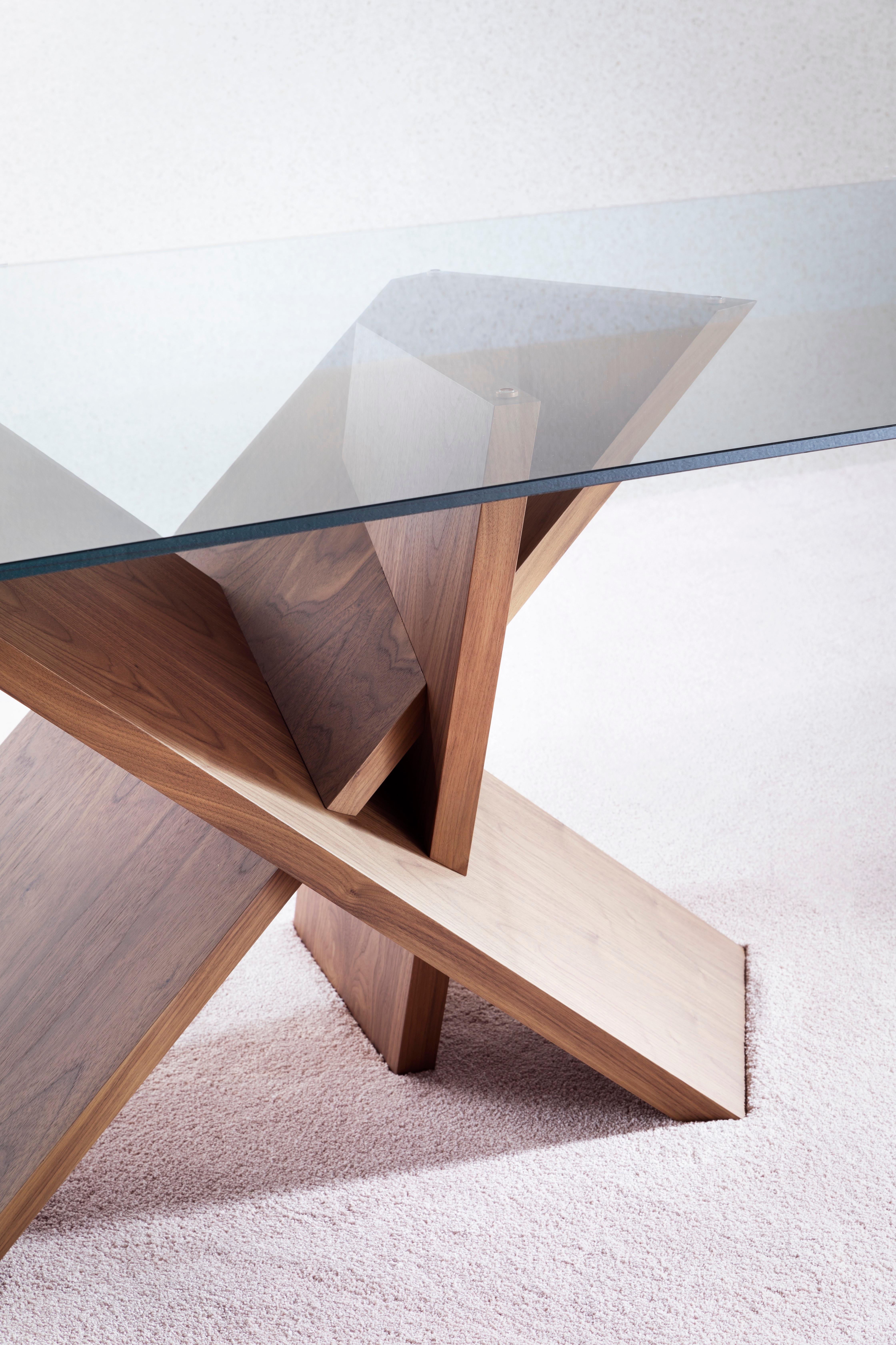 Inspired by Japanese design, Tripode stands between a dining table and a meeting table. The solid volume of the three legs combines with the fineness of the glass, for a statuesque element with strong engagement.

Additional