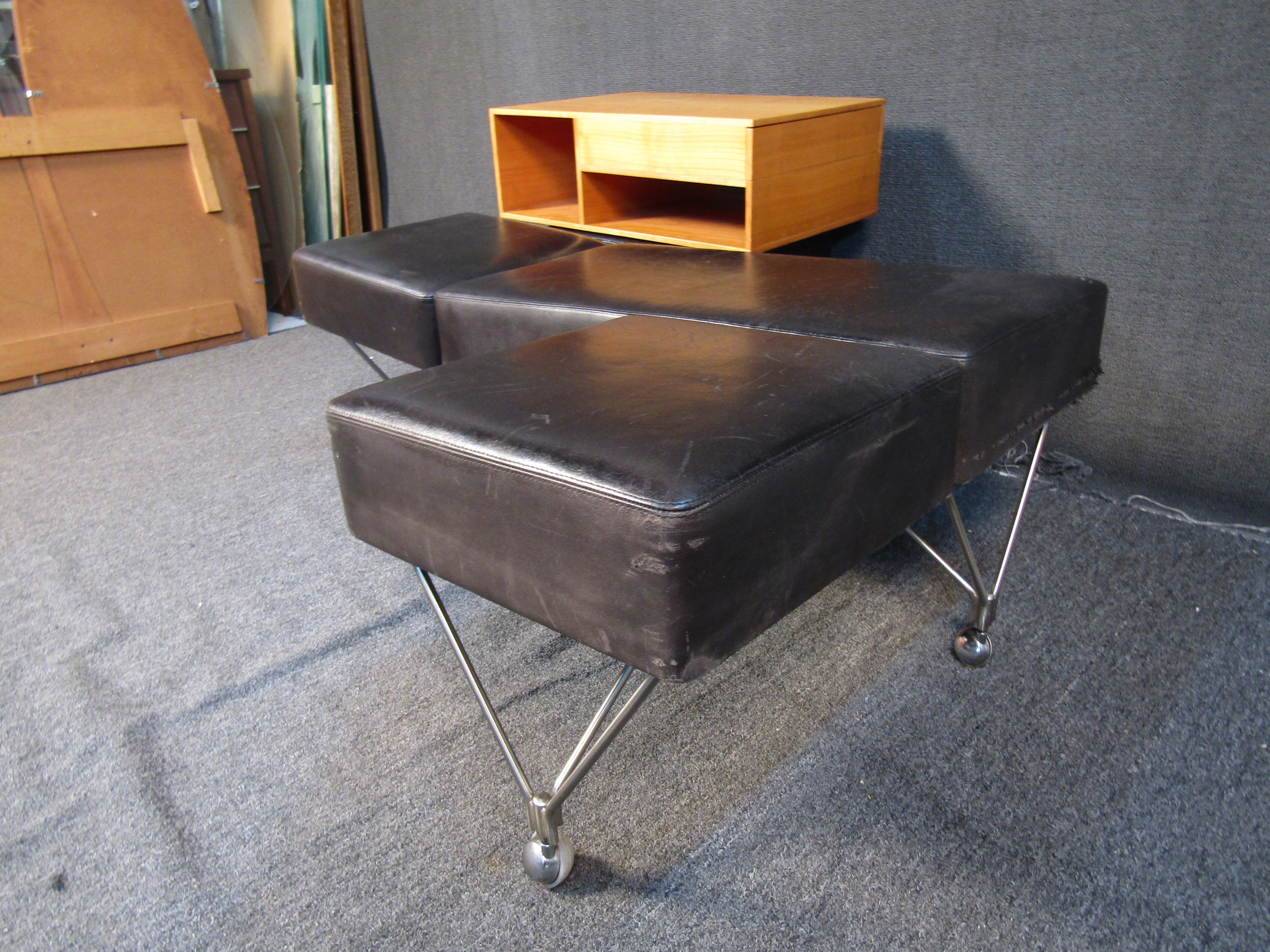 Designed by Gio Ponti for Techno, this Triposto bench features a highly unusual design with a detachable cabinet component. Metal legs and dark leather cushions complement this bench's eye-catching form. Please confirm item location with seller