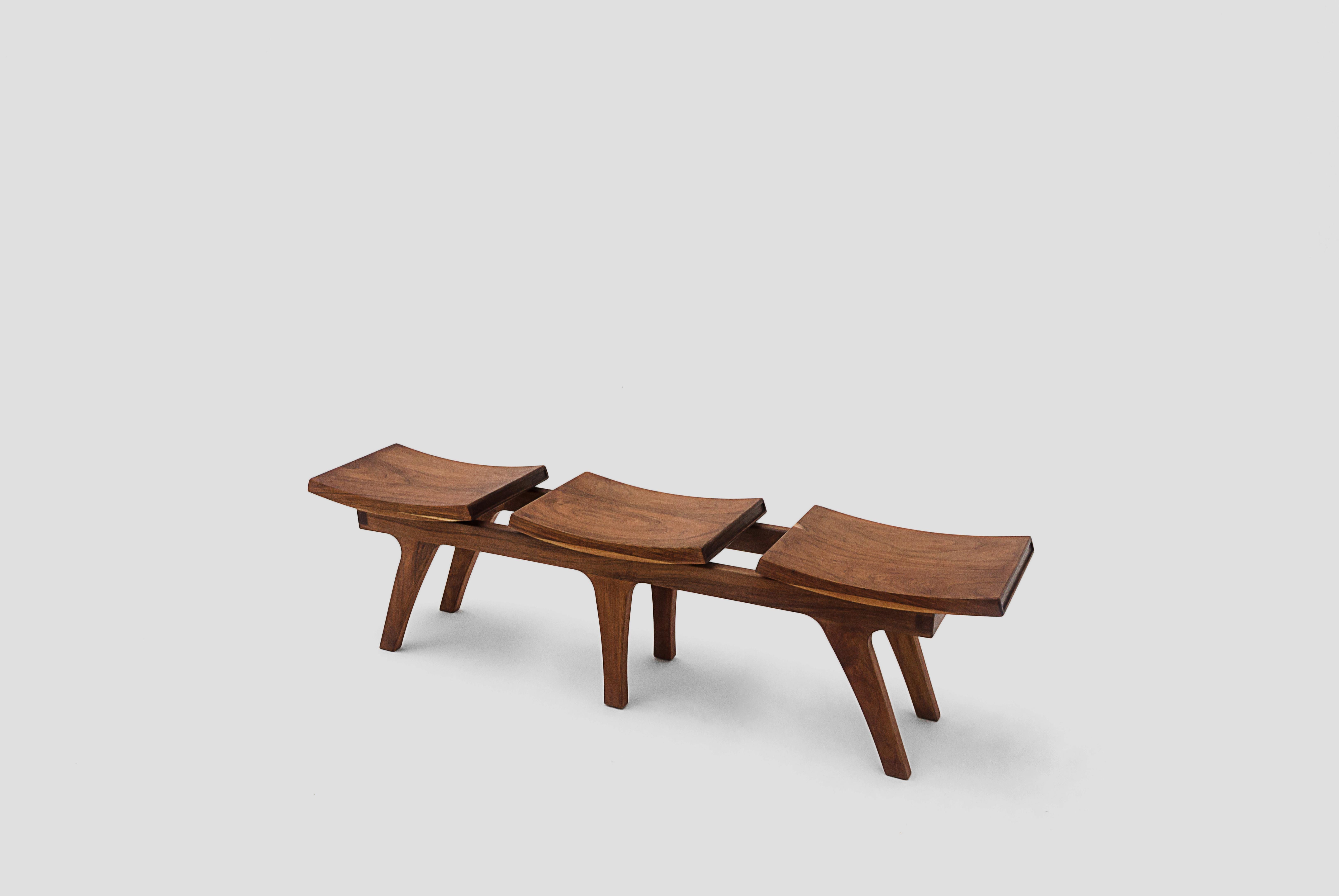 Tripot is a walnut bench with three seats designed by Arturo Verástegui for Breur Estudio. This piece is part of Diseño y Ebanistería, Breur Estudio first ever collection, in which they collaborated with top designers to achieve exceptional