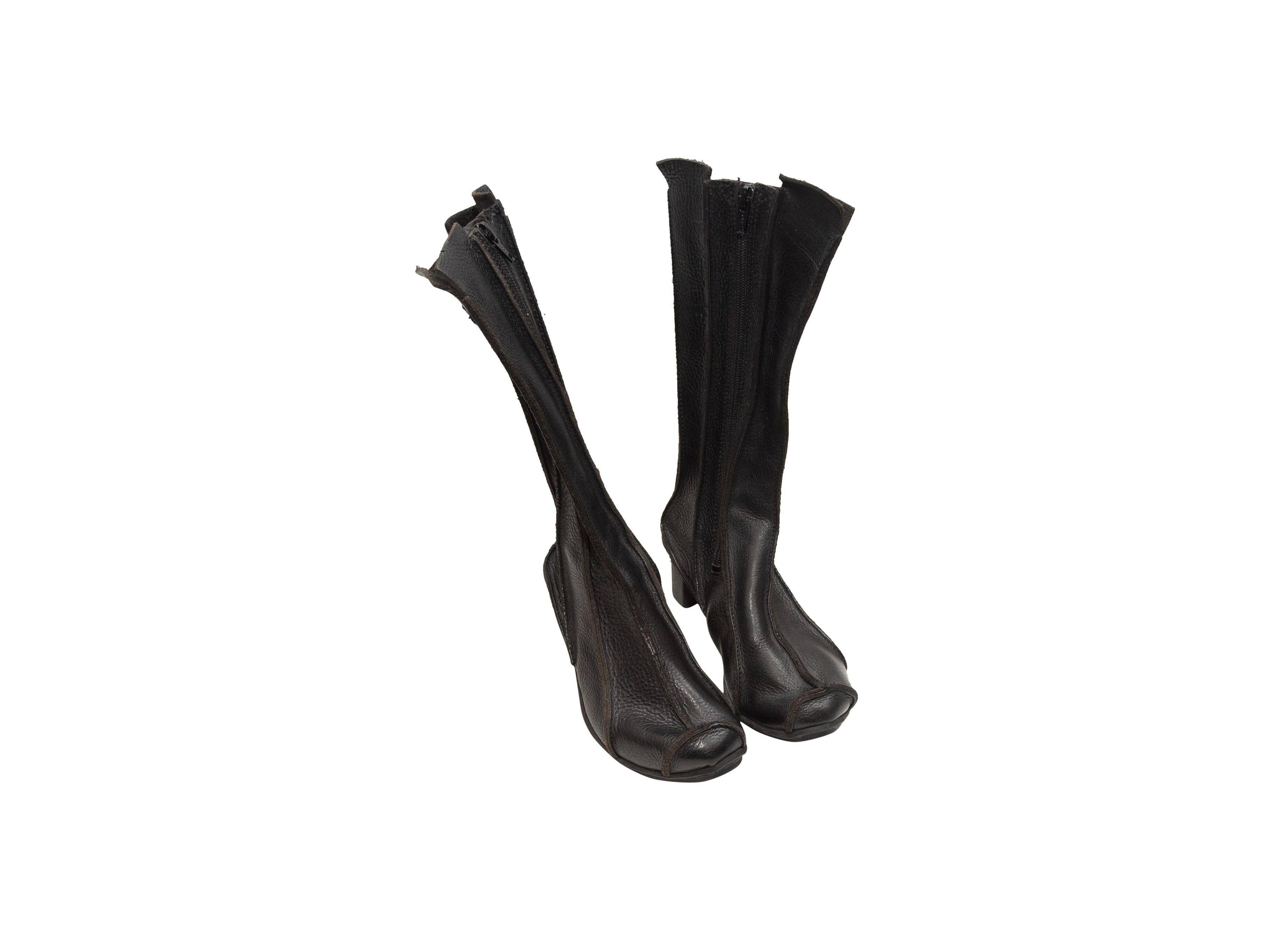 Product details: Black leather panel wedge boots by Trippen. Rubber soles. Zip closures at inner sides. 2