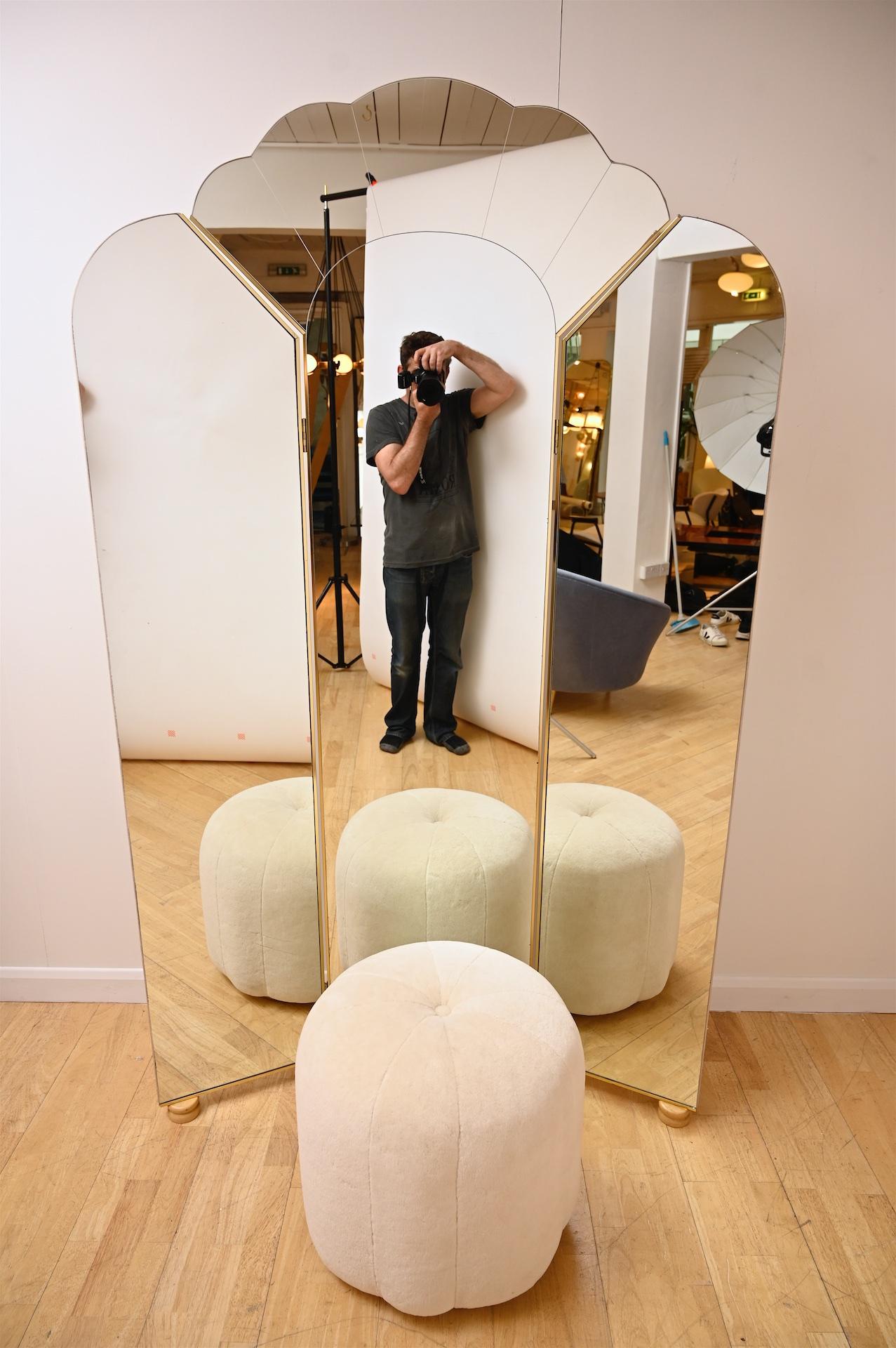 Decco style triptych floor standing mirror with ottoman in off-white teddy alpaca. Designed by Alain Delon for Maison Jansen 

The mirror is fully self supporting. The position of the two side mirrors are easily adjustable.



 