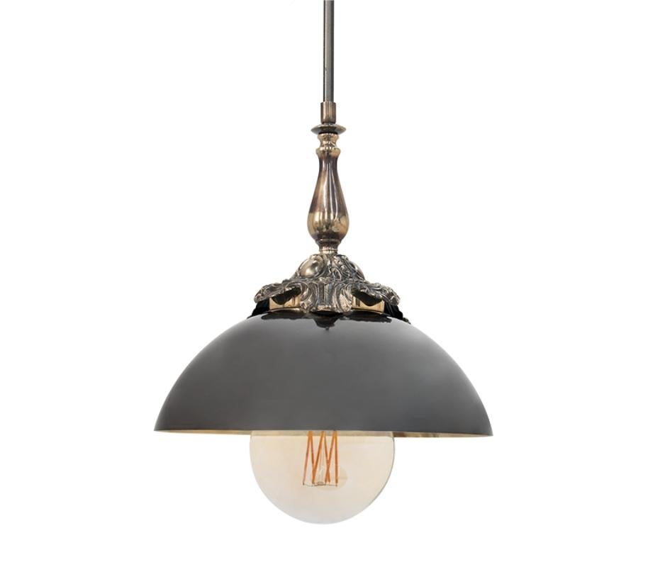 Drawing inspiration from the industrial visual appeal, Triptico is a versatile suspension lamp that balances the finest craftsmanship with innovative design. Composed by a set of three black pendant lights hanged by a round structure, this eclectic