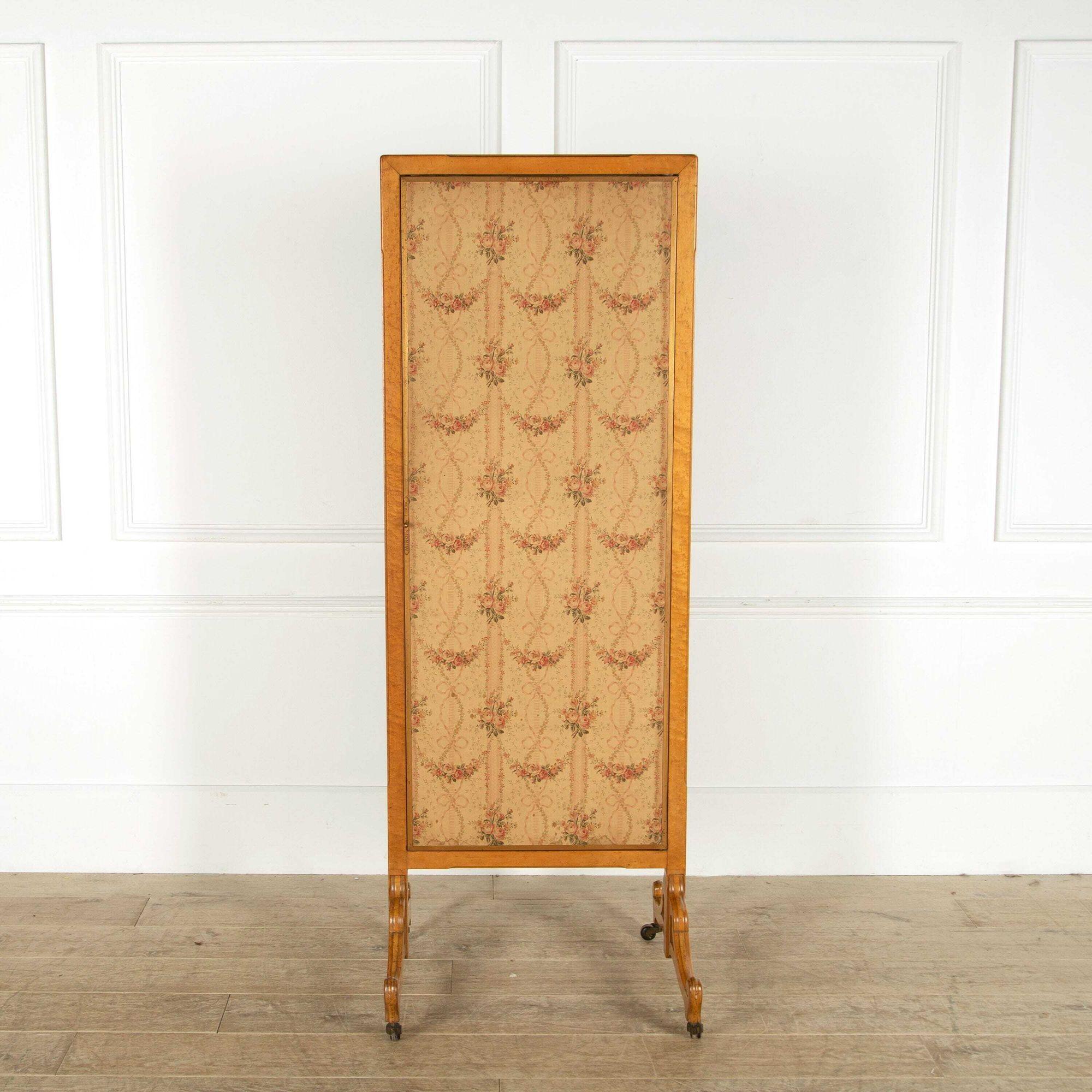 Rare burr maple triptych mirror, from the renowned company Miroir Brot of Paris. Circa 1900. 
This lovely mirror retains its original decorative fabric to the outside and solid brass-framed mirrors to the inside. It bears the Brot label in two