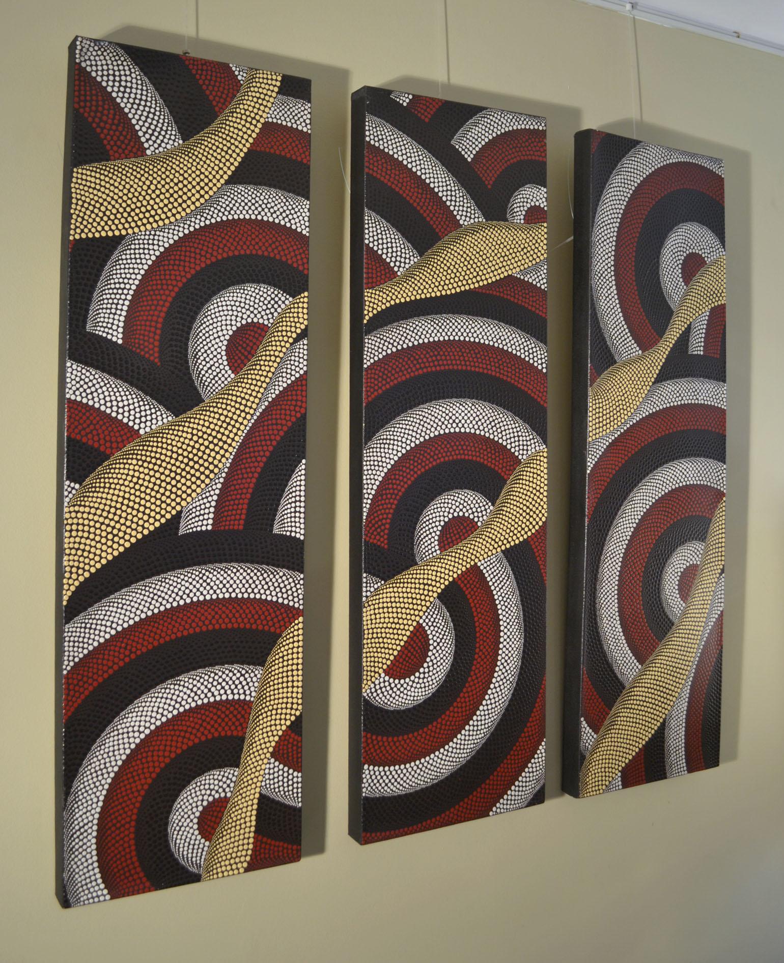 Aboriginal paintings triptych with dots in black, white, red and pale yellow on a black background. Their swirling lines create an optical illusion with the dots descending in size. The painting was purchased by the previous owner in the mid-1980s