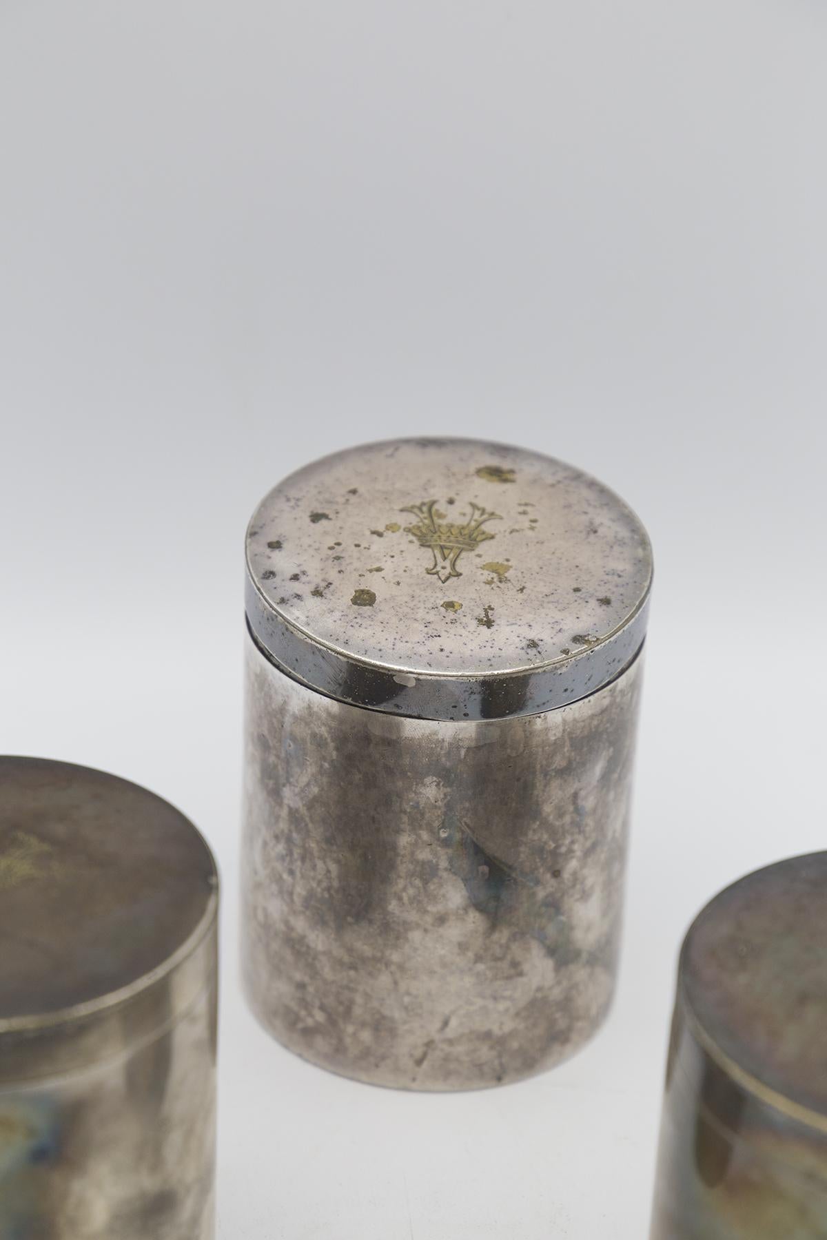 Beautiful antique triptych of silver jars branded Boin Taburet in Paris, a very famous and highly prized 20th century French silver manufactory.
The jars are exactly identical and have a cylindrical shape with a flat base and top. All have a cap