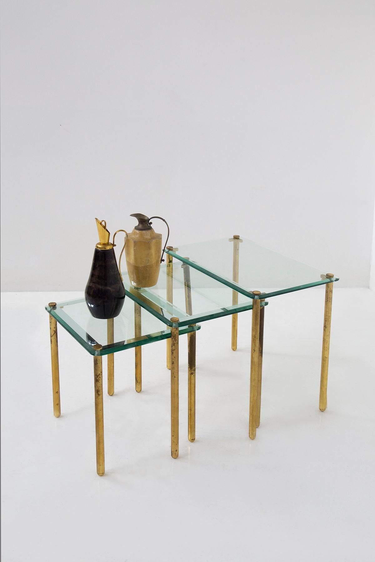 Step back in time to the glamorous 1960s and behold this exquisite triptych of vintage Italian coffee tables, a true testament to design sophistication. These tables are not just pieces of furniture; they are functional works of art that will leave