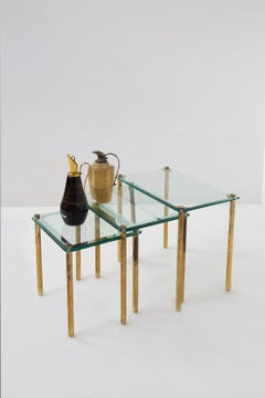 Triptych of vintage Italian coffee tables in thick glass and brass