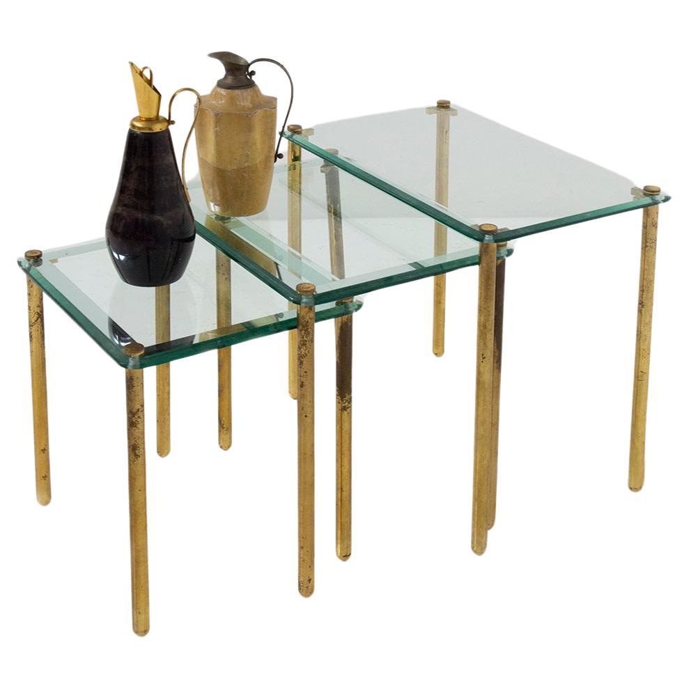 Triptych of vintage Italian coffee tables in thick glass and brass For Sale