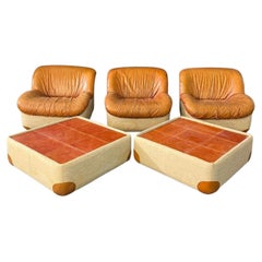 Vintage Trio of armchairs with two leather side tables/footstools