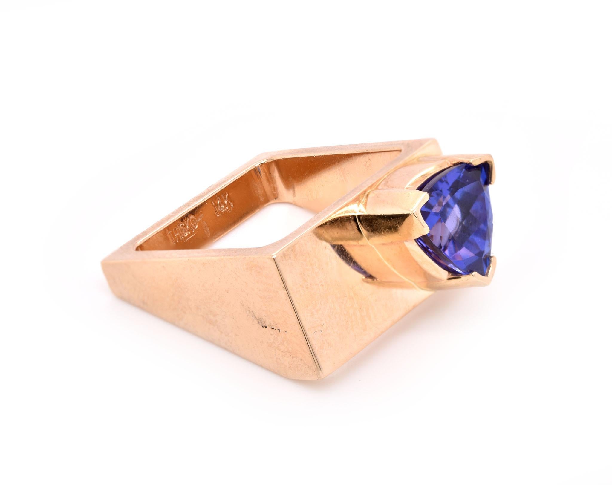Designer: Trisko
Material: 14K yellow gold
Tanzanite: 1 trillion cut = 1.50ct
Size: 5.25 (please allow two additional days for sizing)
Weight: 12.16 grams