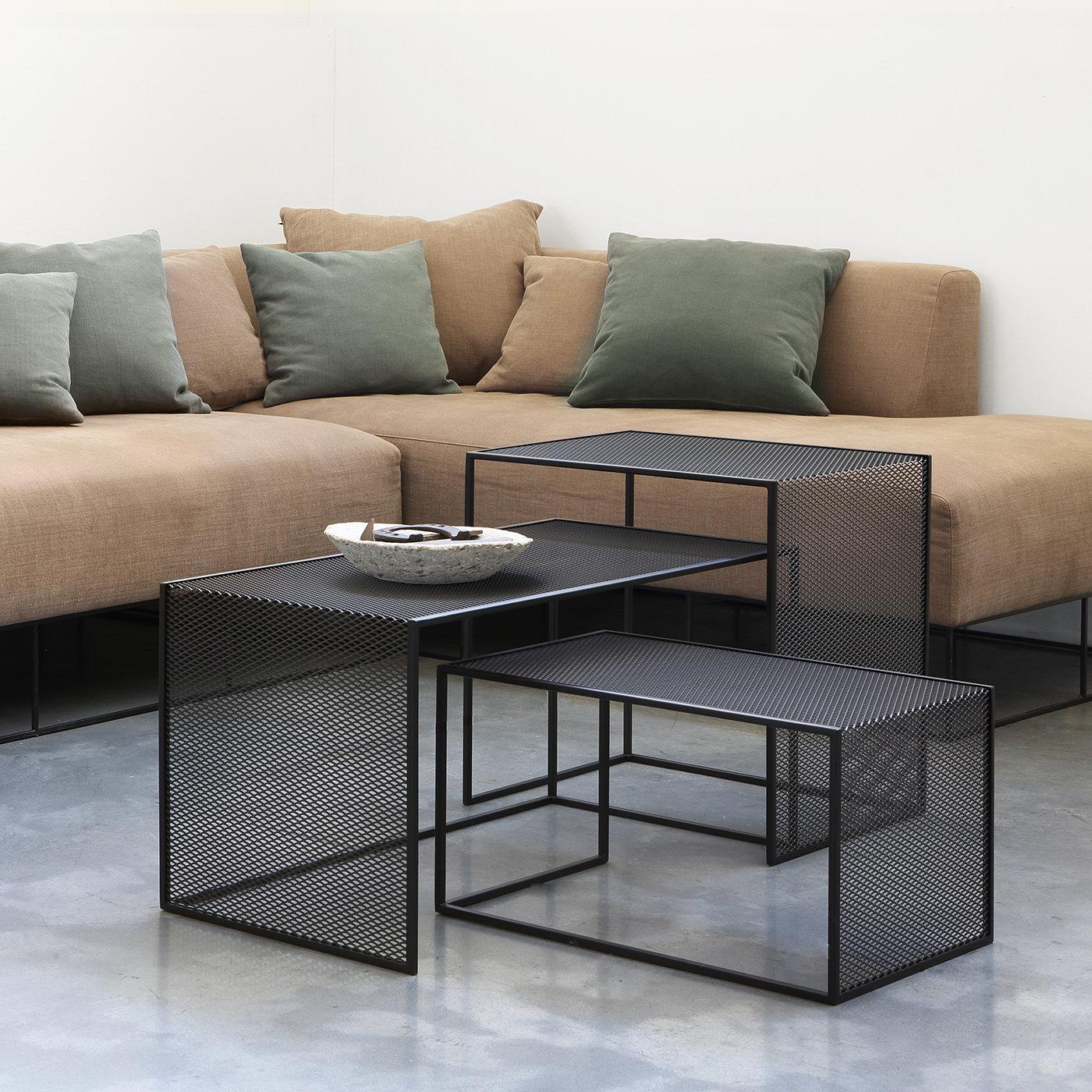 Highly functional and original in design, the Tristano Low Tables are crafted with a frame in 10 x 10 mm solid steel tube and the top and sides in expanded metal. The composition of three tables of varying sizes (40 x 80 x H 40 cm / 35 x 55 x H 30