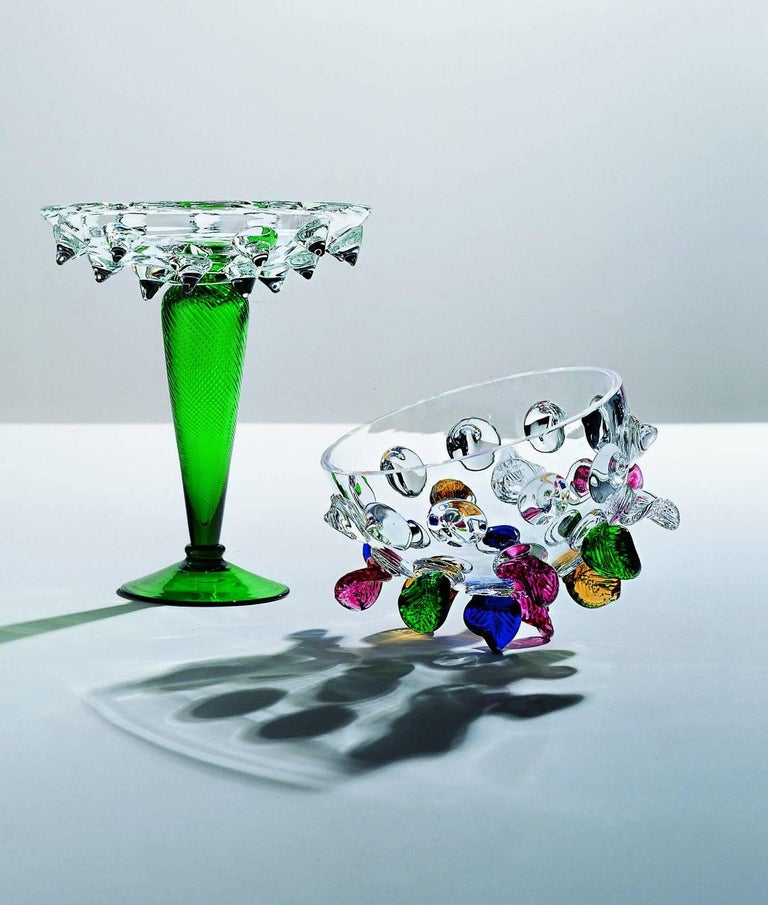 Elegant centrepiece in clear and green glass with gem decorations. 

Borek Sipek (1949-2016). After studying interior design at the school for Arts & Crafts in Prague (1964-1968), he went to Germany to study architecture at the Kunsthochschule in