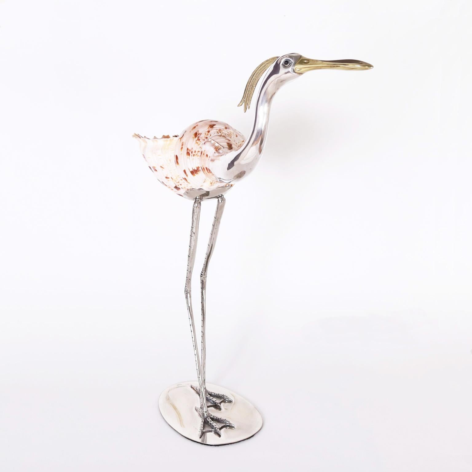 Mid century bird or stork sculpture crafted with silvered metal, brass, and an organic conch shell in a familiar pose. Stamped Binazzi Firenze on the base.