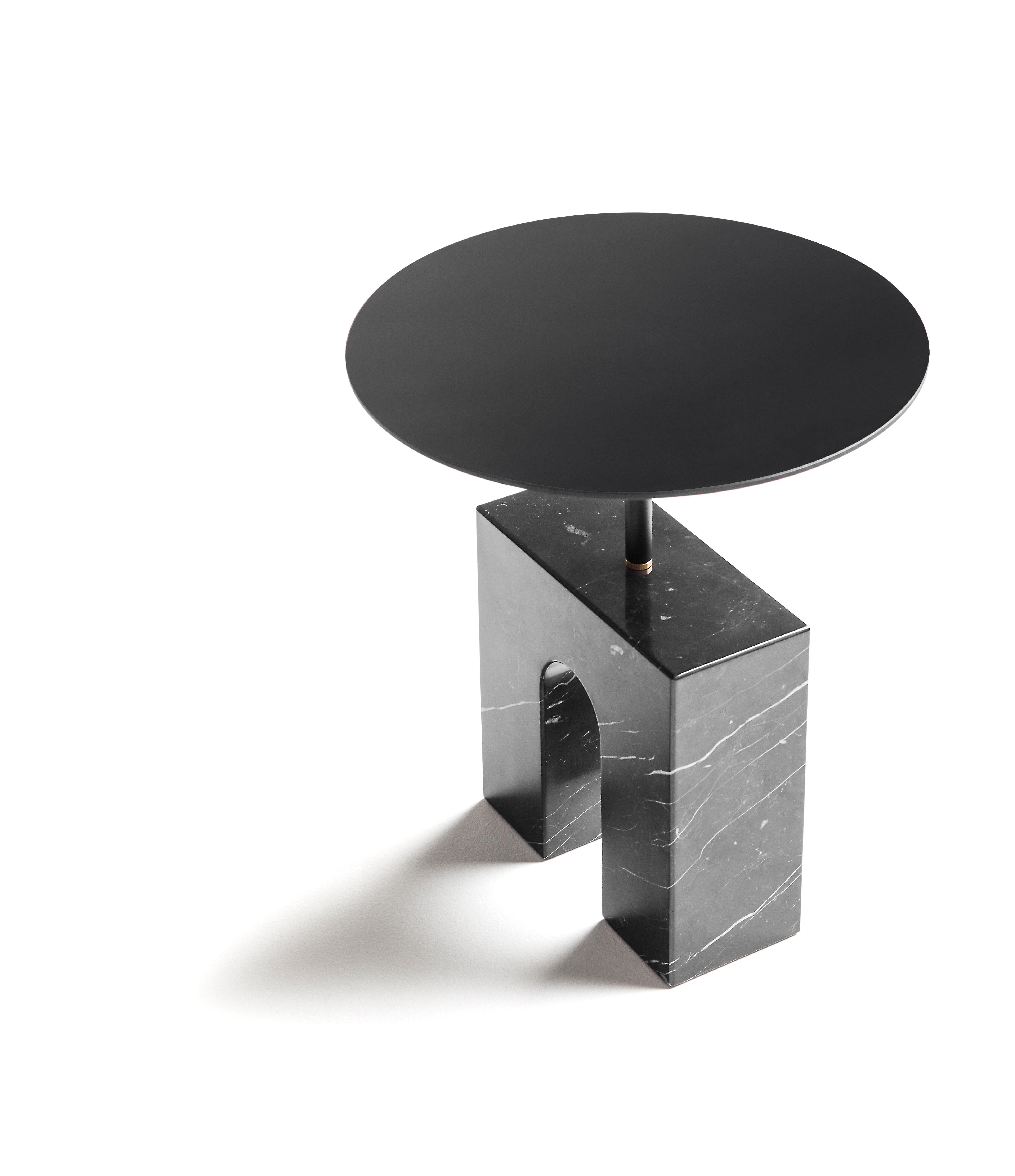 The Triumph Side Table is a minimalist style side table consisting of a treated Marquina marble base, a black lacquered aluminum round shaped top and a small brass piece, as a nexus between the two previous parts, all of them assembled in a logical