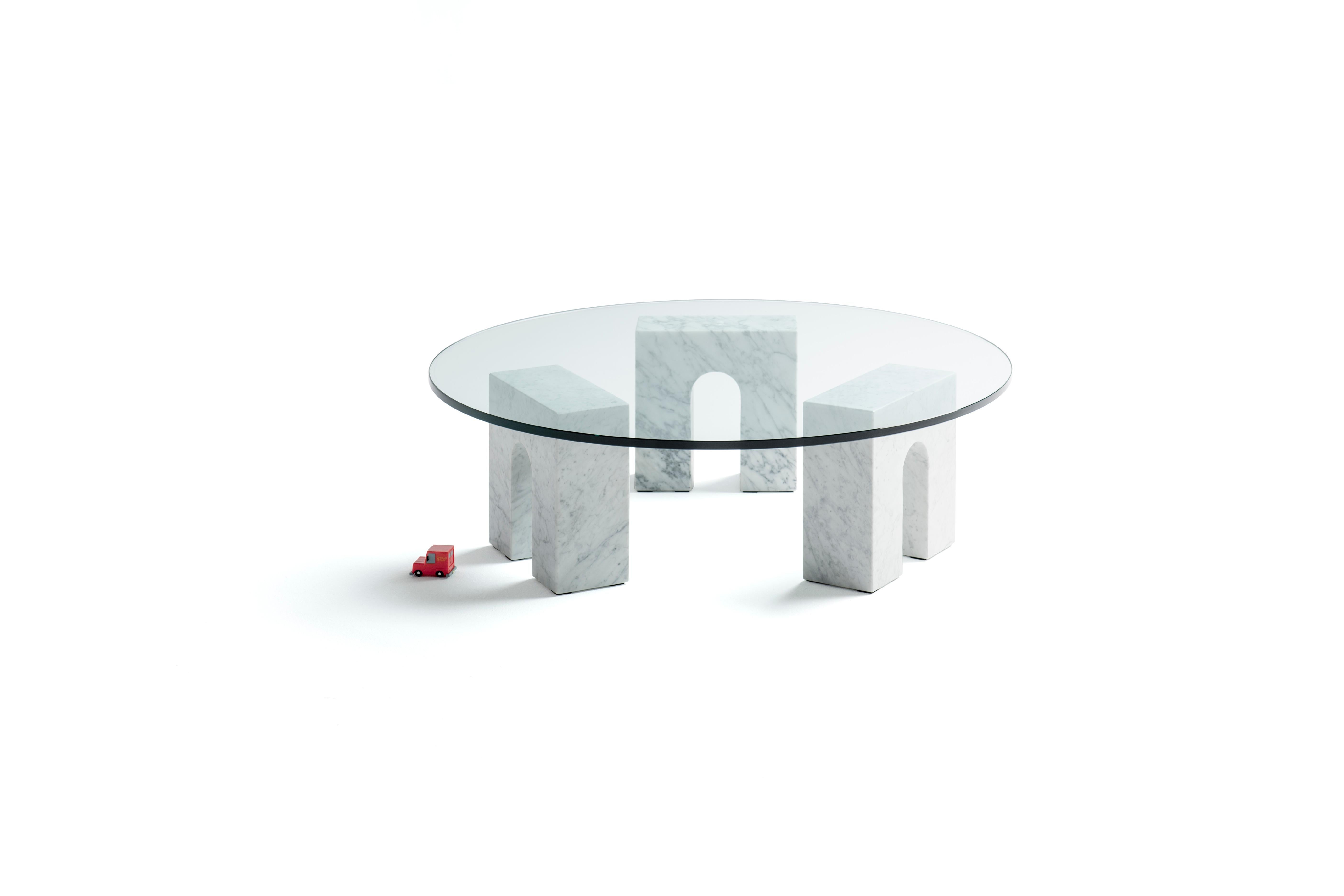 The Arch Table is a minimalist style coffee table consisting of three treated Carrara marble bases and a round shaped tempered glass top, all of them assembled in a logical and harmonious way.
Josep Vila Capdevila, head designer of Aparentment, was