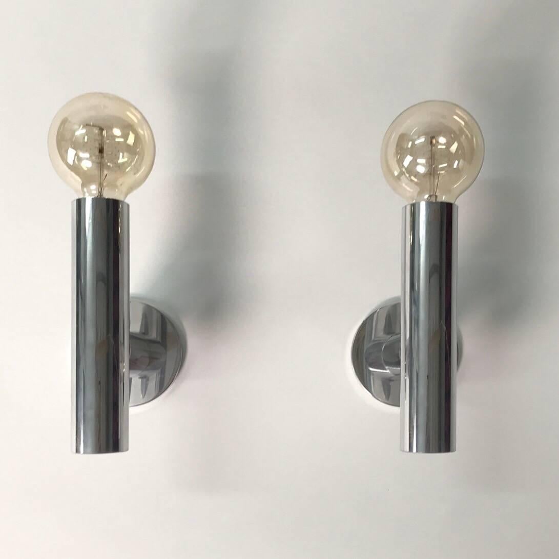 Rare set of wall sconces by Trix and Robert Haussmann for Swiss International, 1960s. 

Minimalism is the keyword oif this beautiful set of sconces made of polished aluminum.

The set is part of the Molecule design which has become an icon for