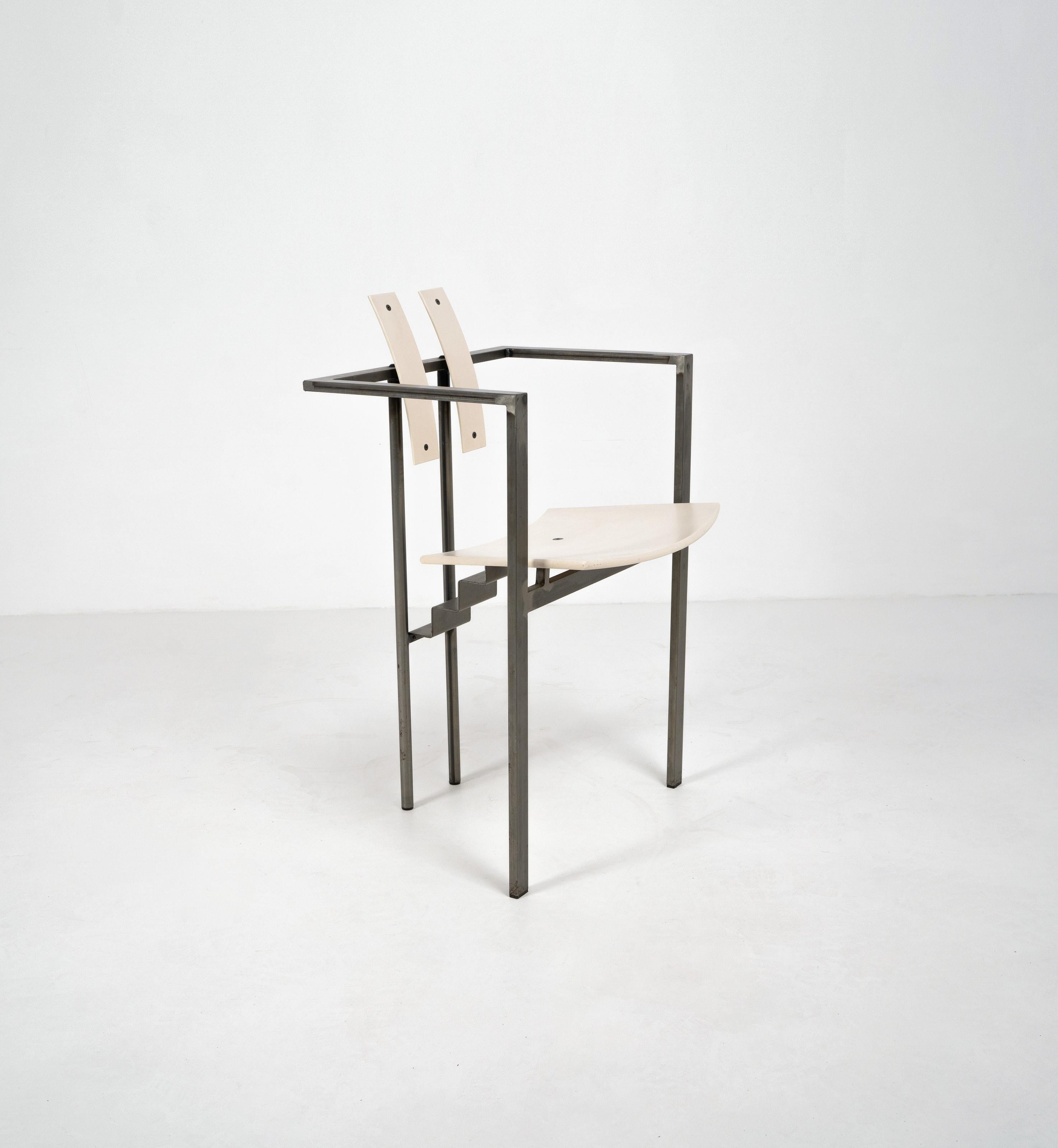 A postmodern 'Trix' chair designed by Karl Friedrich Förster and produced in the 1980's. Composed from a tubular steel frame, off white bent plywood backrests and an off white painted plywood seat. 


Dimensions (cm, approx): 
Height: 82
Width: