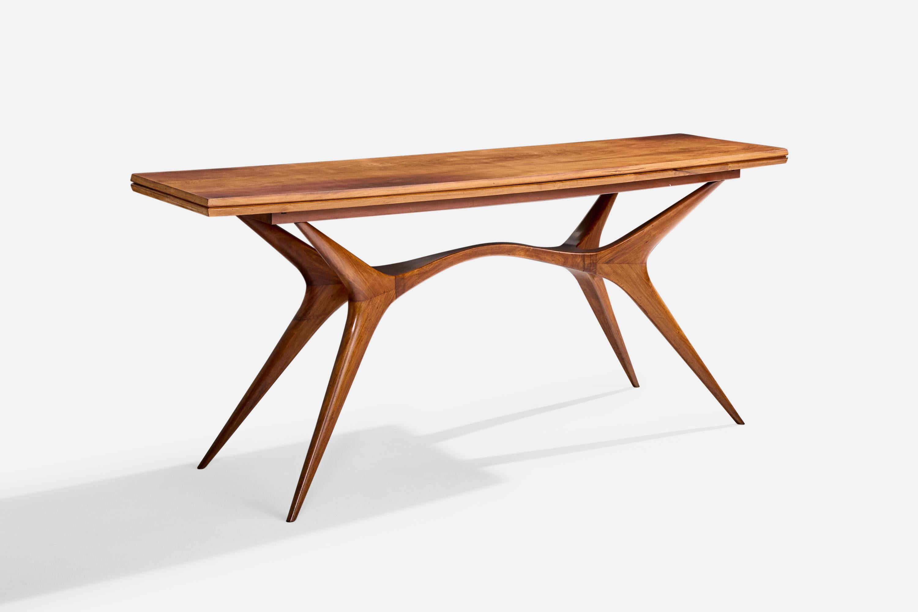 A wood flip-top console table produced by Trofelli & Favaro, Brazil, c. 1950s.

Minor wear at the sides of the middle crease where the two halves meet/fold over. Touch ups carried out.

Console Dimensions: 31” H x 70.625” W x 20.4” D

Dimensions of