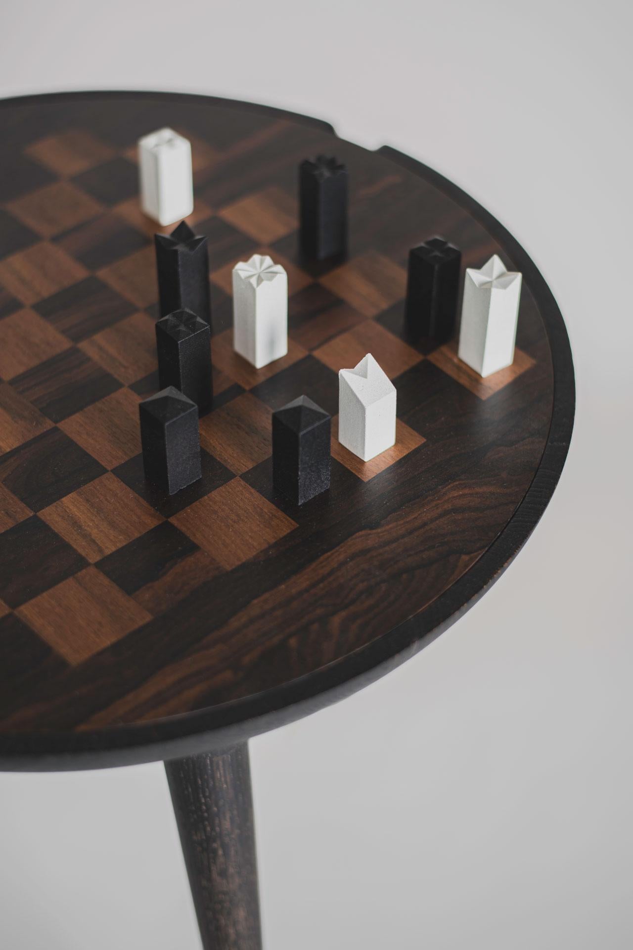 We've broadened our family of Trojan chess tables with a richly dark variant. The hue is achieved through a chemical reaction, so it doesn't rely on using a color pigment that might fade over time. Both the chessboard and the opposite side of the