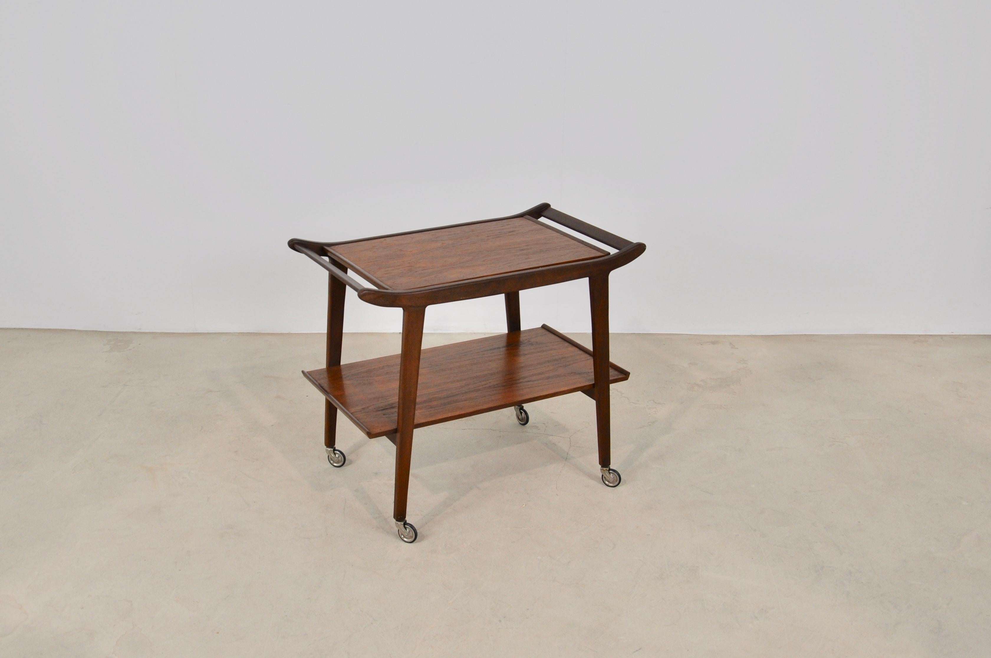 Teak trolley with removable tray. Wear and tear due to time and the age of the trolley.