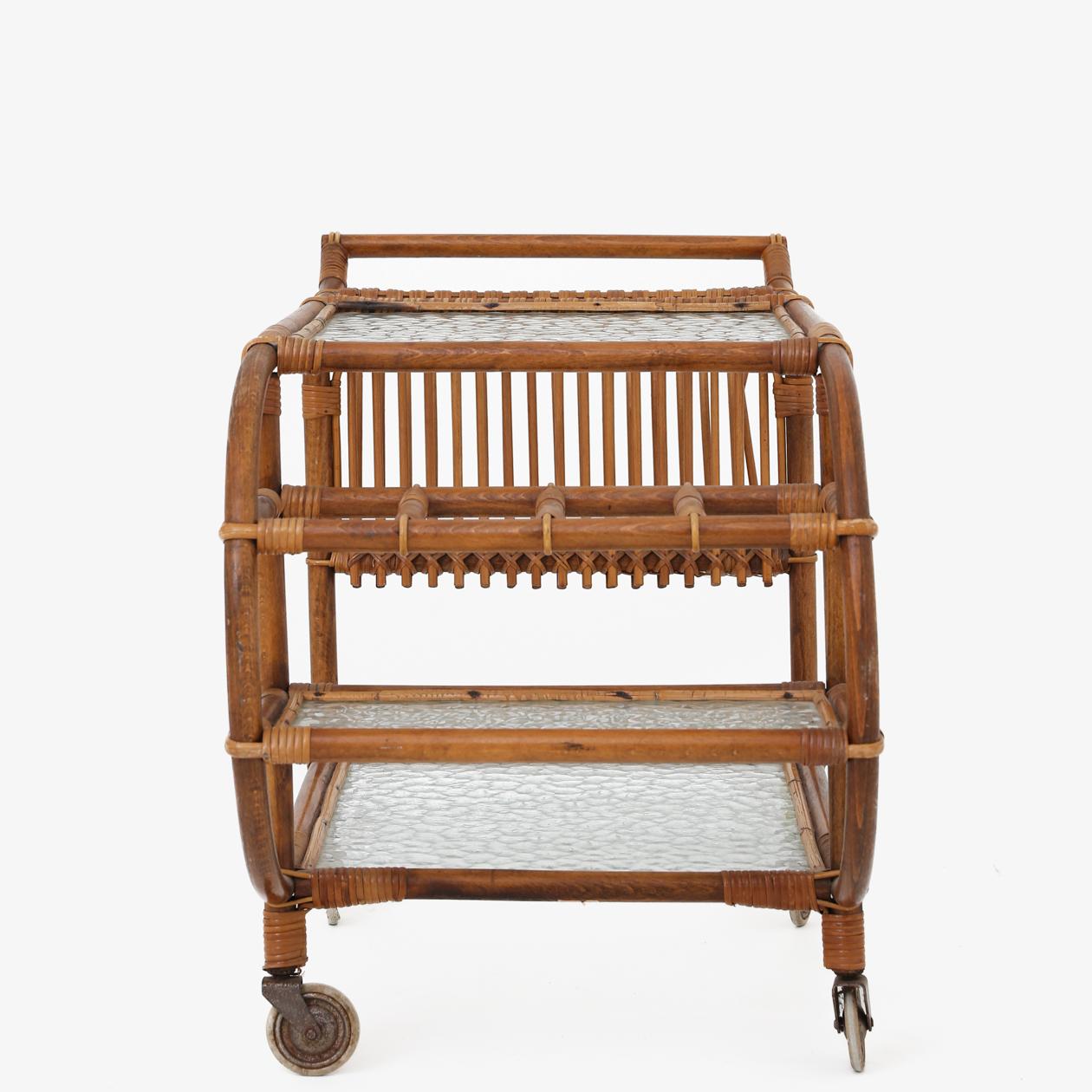 Trolley in rattan and shelf in frosted glass. R. Wengler.