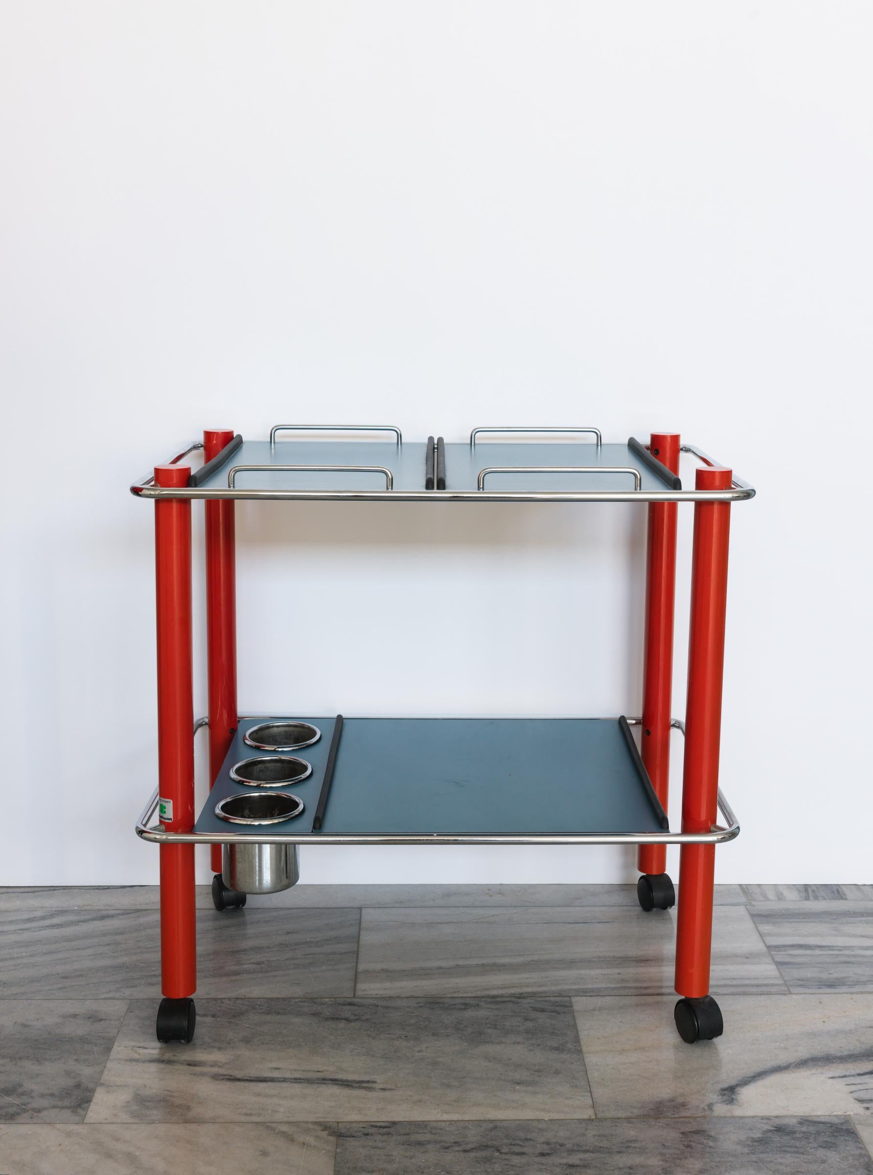 Italian drinks and serving trolley by Bieffeplast Padova. Upper and lower removable and interchangeable tray sections as well as bottle storage.