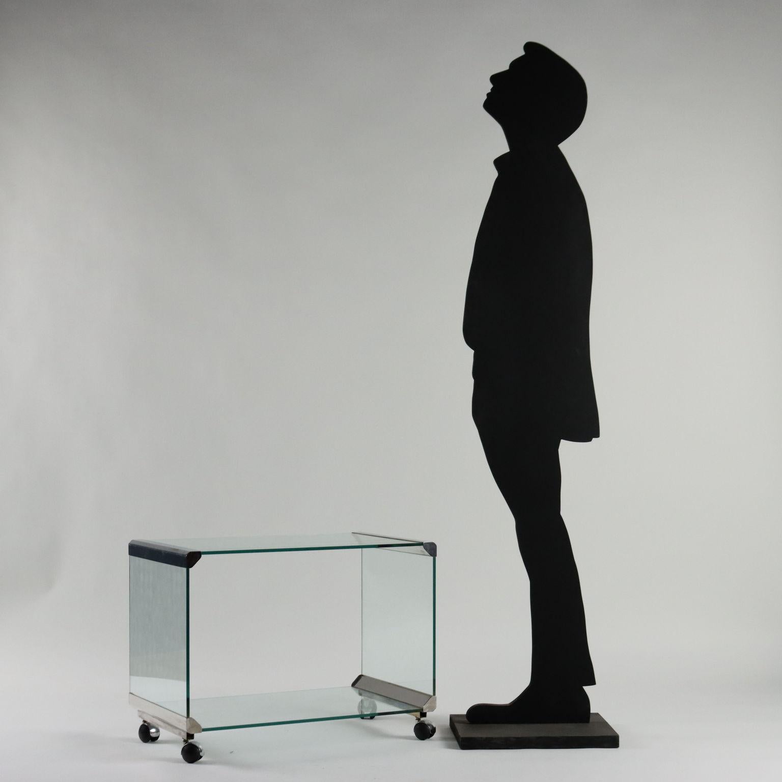 Trolley-table; glass with chromed steel profiles.