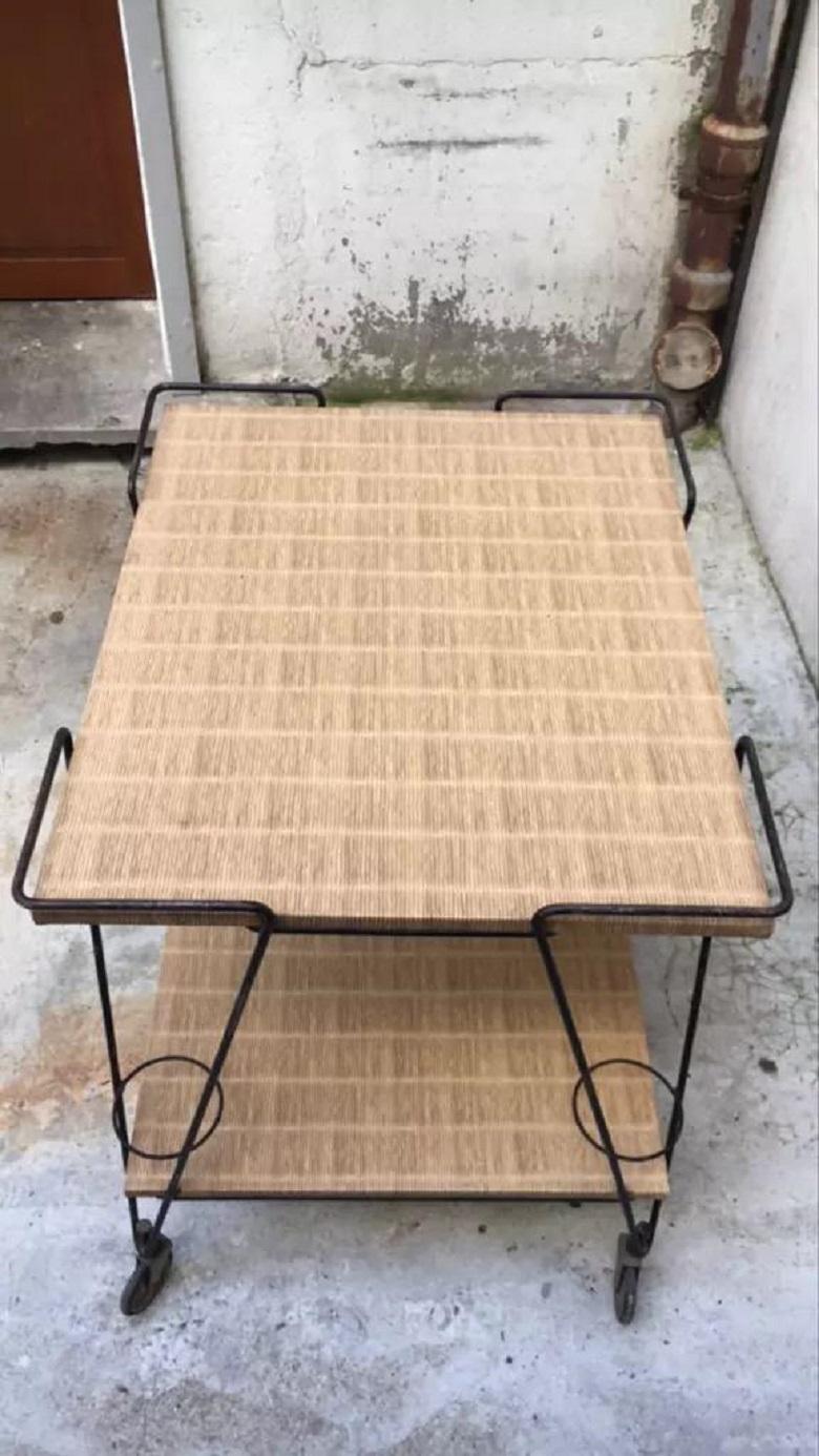 Trolley by Mathieu Matégot made by Les Ateliers.
Matégot France 1950s.

Troley in wood and straw perforated metal.
The 2 straw trays are in poor condition.
The structure and the perforated metal is in good condition.

