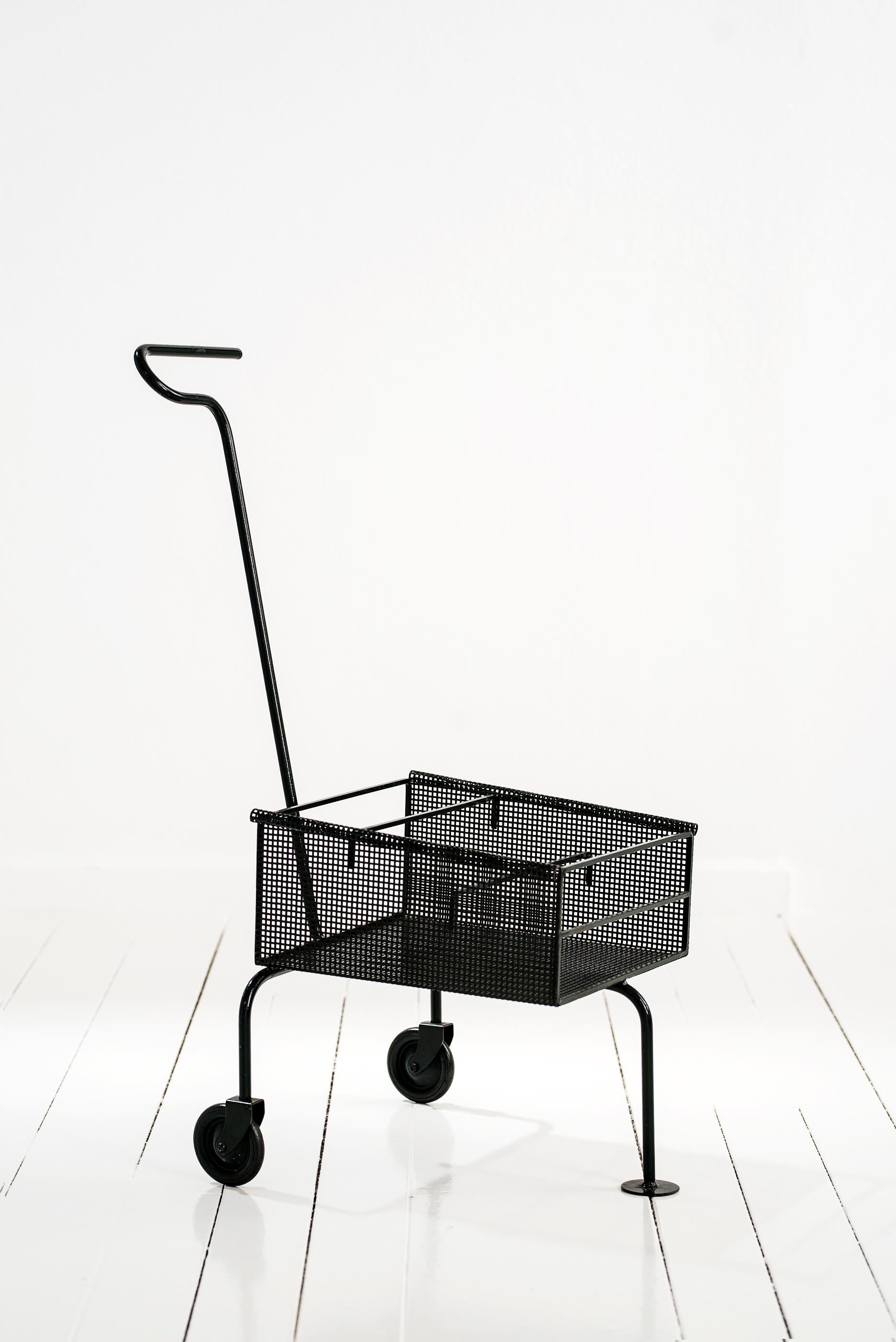 Car by Mathieu Mategot, model Trolley Pousse-Pousse
Made of perforated metal
circa 1953, France
Preserving original patina

Measurements: 75 × 41 × 64 cm.