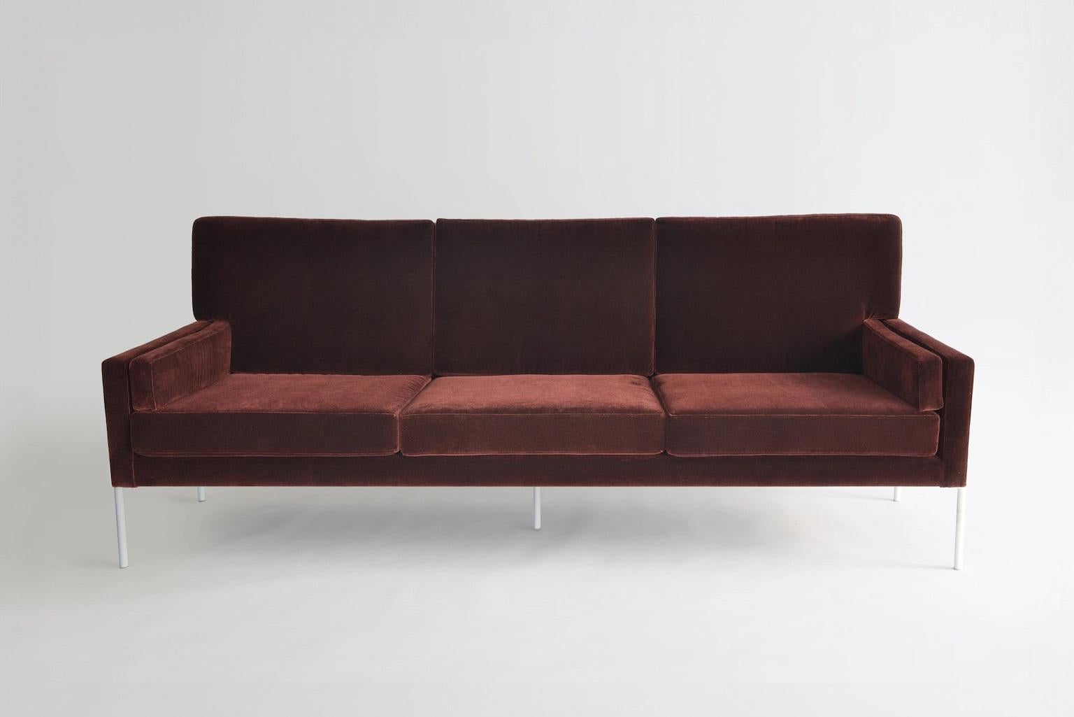 Trolley Sofa by Phase Design
Dimensions: D 77.5 x W 212.7 x H 81.3 cm. 
Materials: Upholstery and powder-coated metal.

Solid steel bar available in a smoked brass, polished chrome, burnt copper, or powder coat finish with an upholstered top. Powder