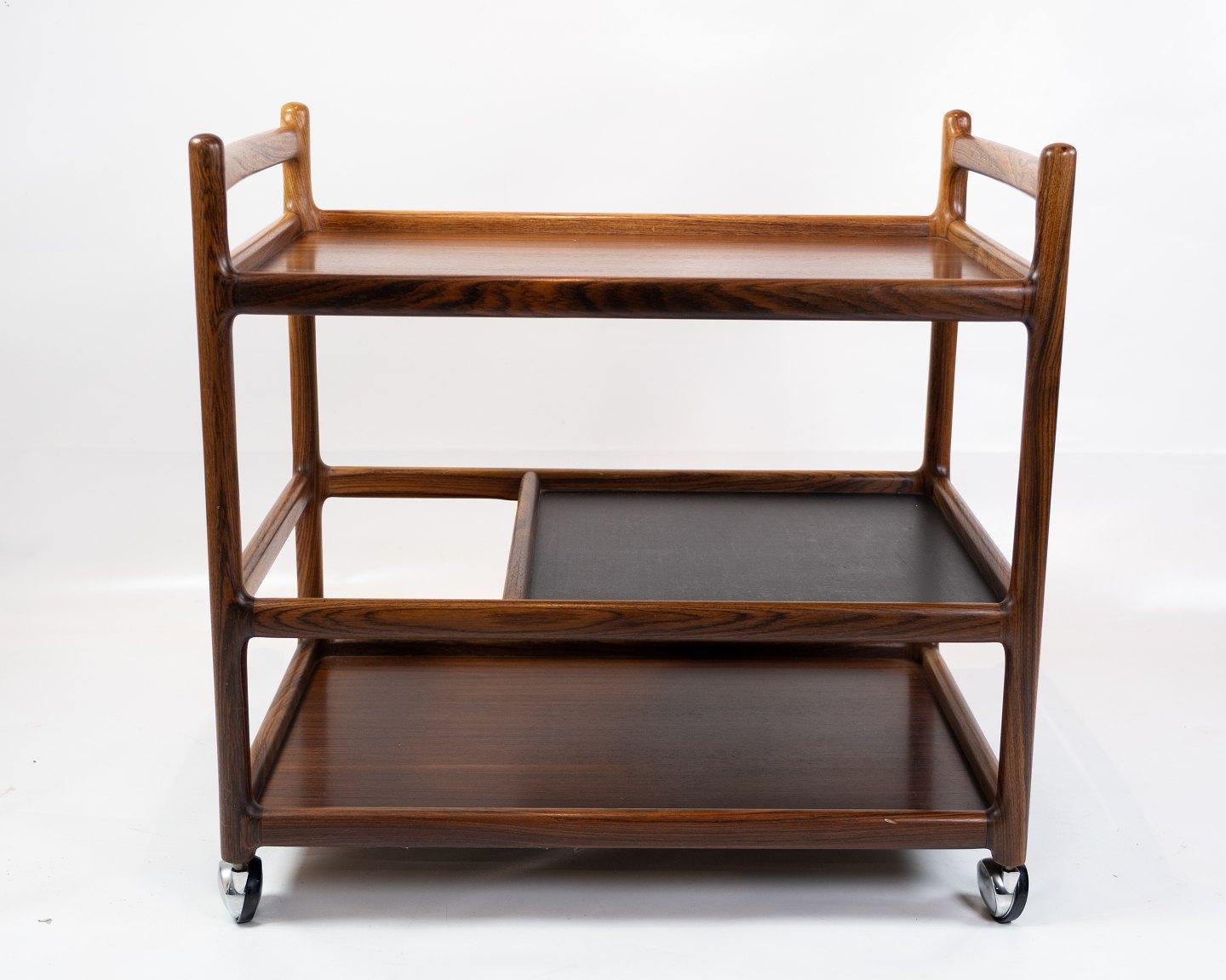 Trolley table in rosewood designed by Johannes Andersen and manufactured by Silkeborg Furniture Factory in the 1960s. The table is in great vintage condition.
 