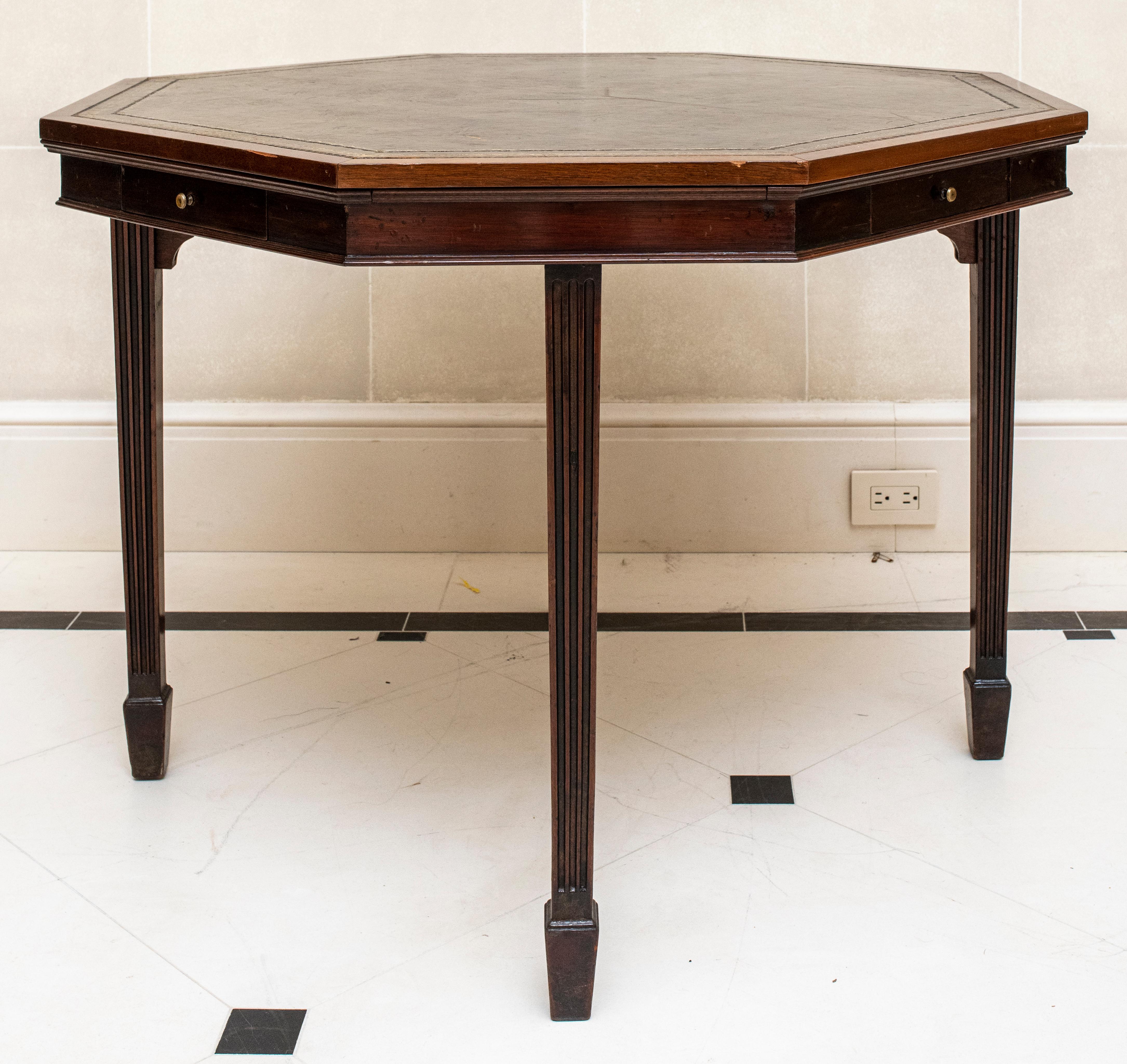Trollope & Colls English octagonal mahogany bridge card table with drawers and tooled leather top, makers mark on drawer, early 20th century.