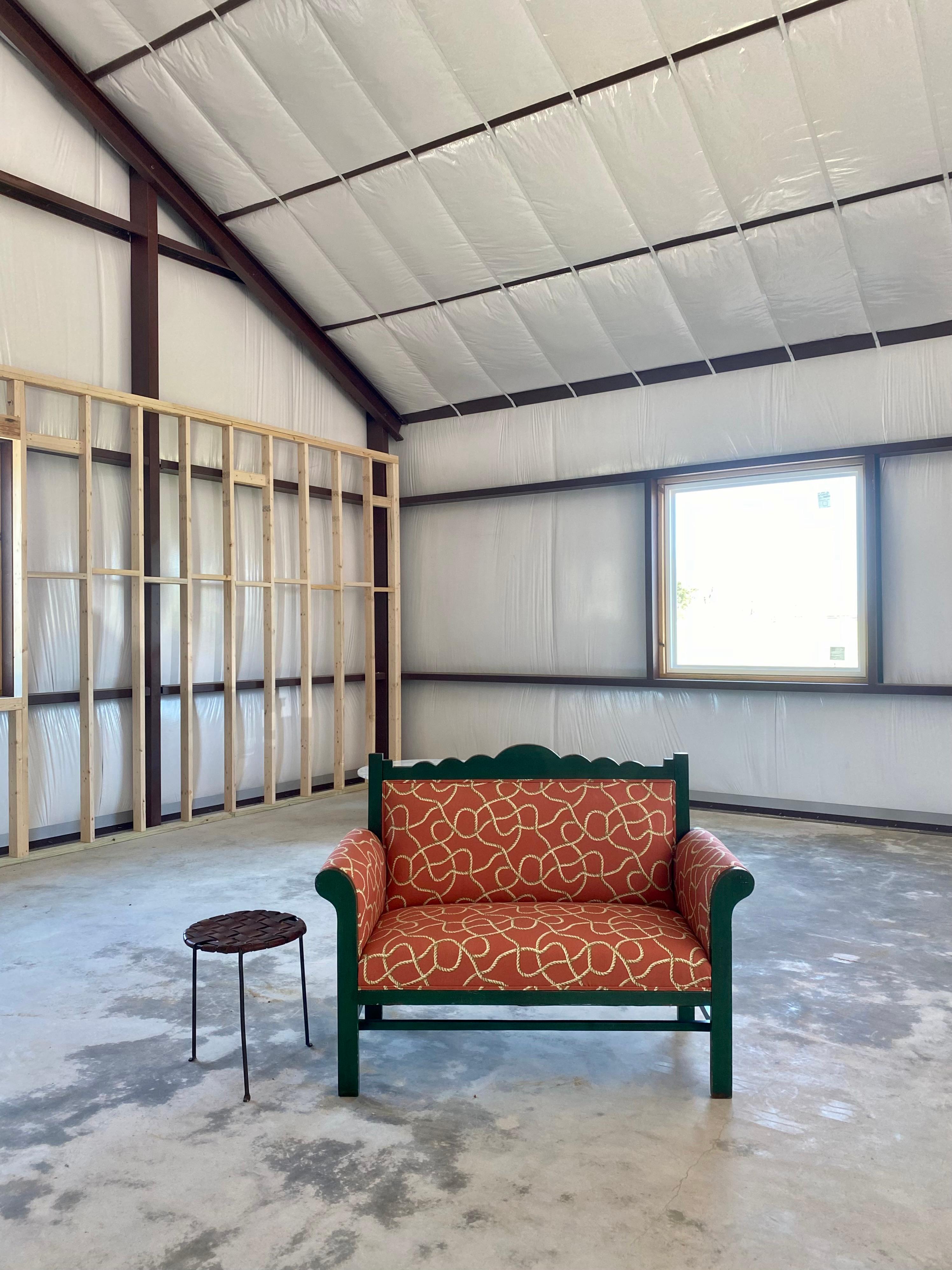 Surrealist-Style textile settee with a folk art frame in original green paint.

We've added a vintage textile in a rope print that gives it a one-of-a-kind look that we absolutely love. The tromp l'œil textile incorporates tones of olive green in