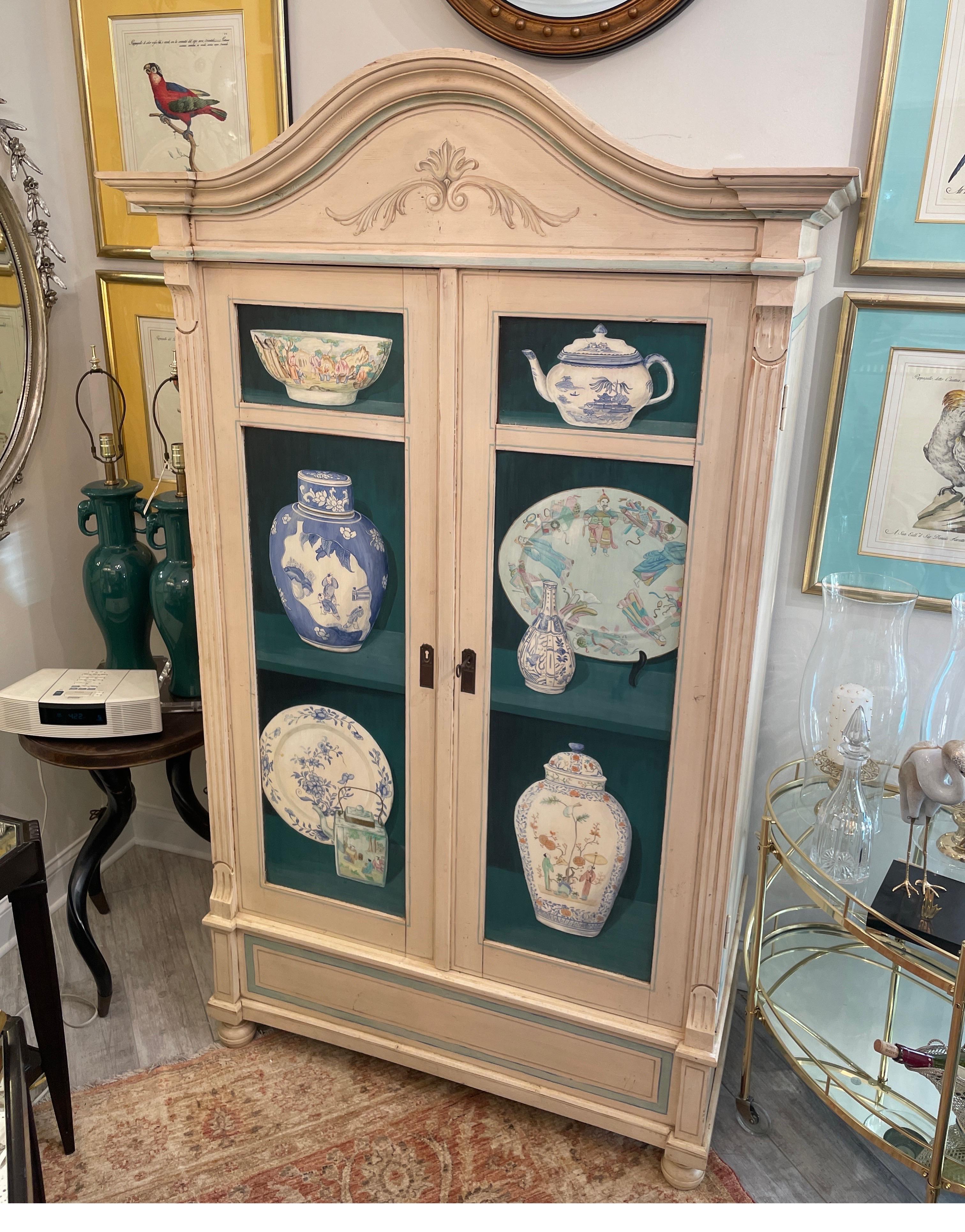 Hand painted Trompe L'oeil cupboard with three interior shelves. Great storage for entertaining pieces or linen press.