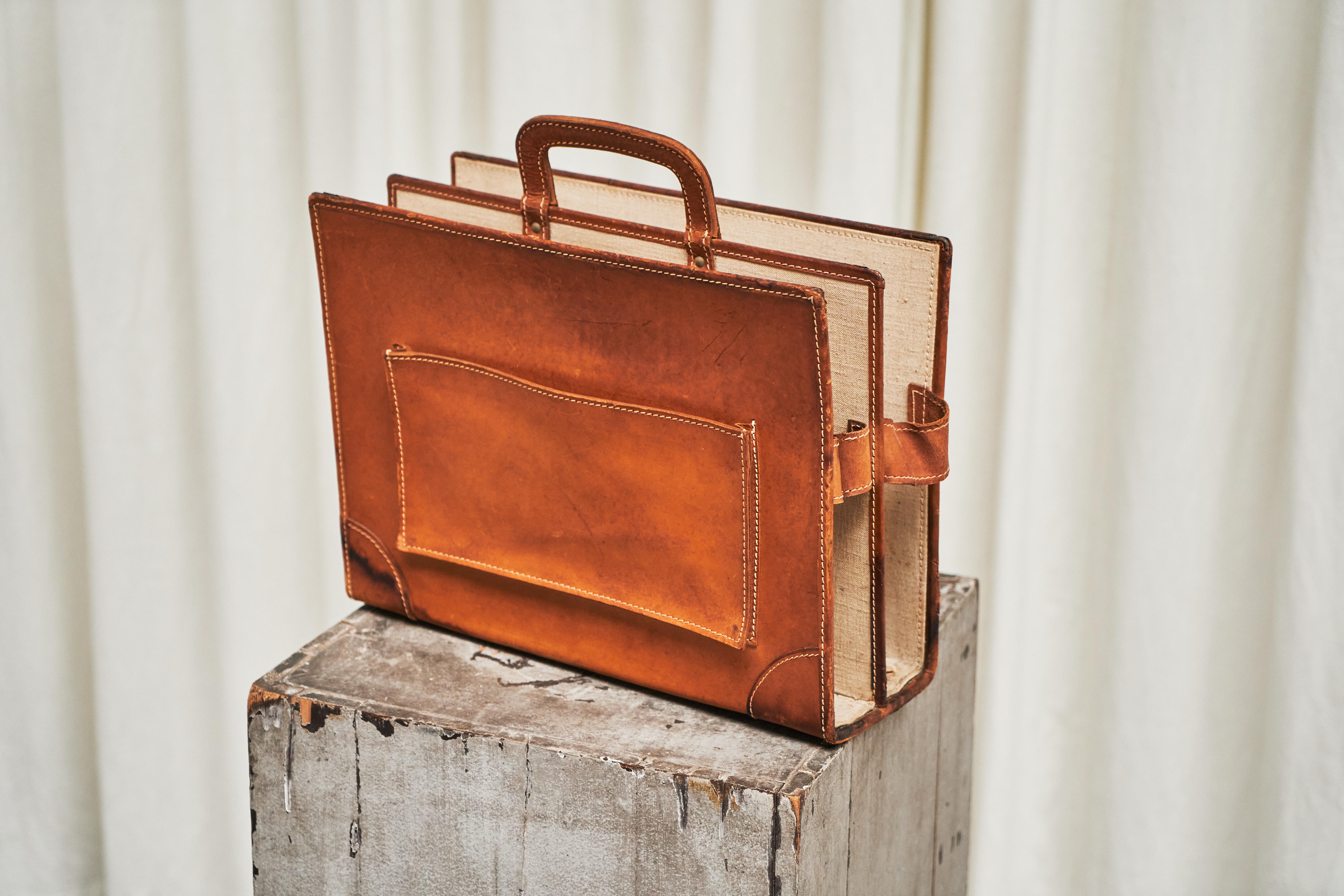 Trompe-l'oeil 'Briefcase' Magazine Stand in Patinated Cognac Leather and Canvas 1970s

This is something special and quirky - we’ve never seen one before. A wonderful trompe-l'oeil 'Briefcase' style magazine stand in patinated cognac leather.

It is