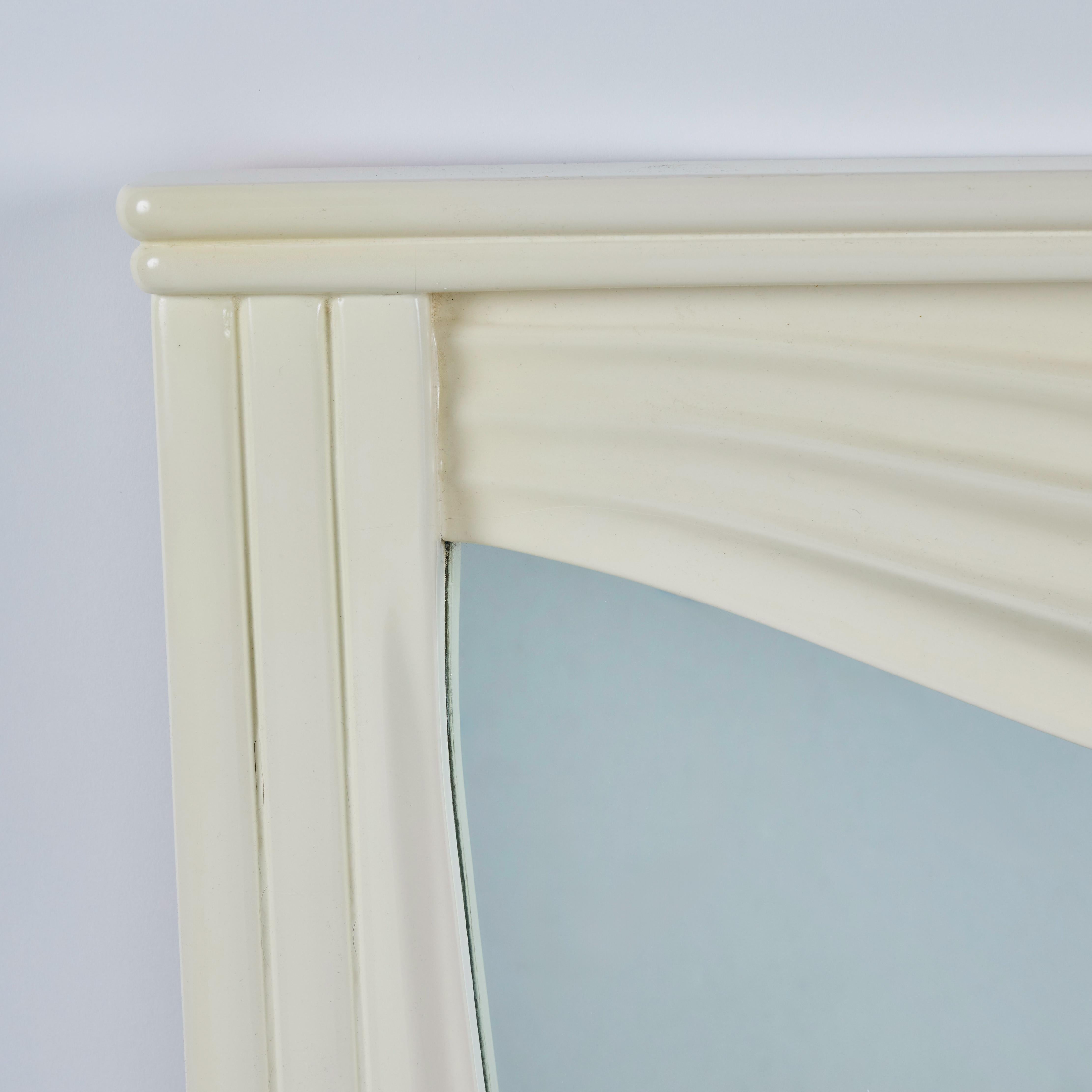 Whimsical mirror in the trompe l'oeil style made of carved and draped wood with cream lacquer finish.  1980's.  Very good vintage condition.