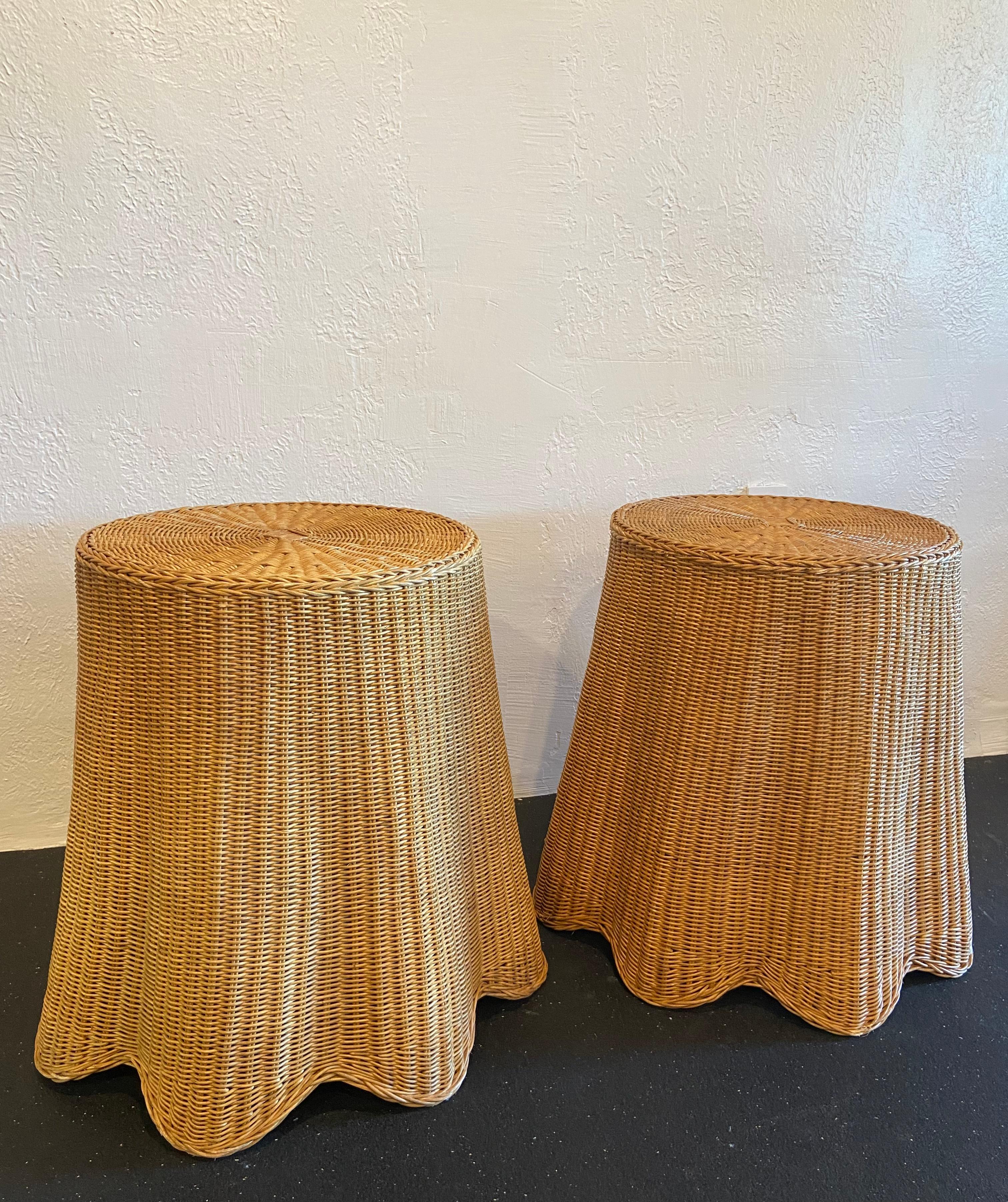 Pair of Trompe L'oeil draped wicker tables. Dimensions are at the tables widest points. The tops are 17.5” round. Some wear found to wicker common with normal use (please refer to photos). 

Would work well in a variety of interiors such as