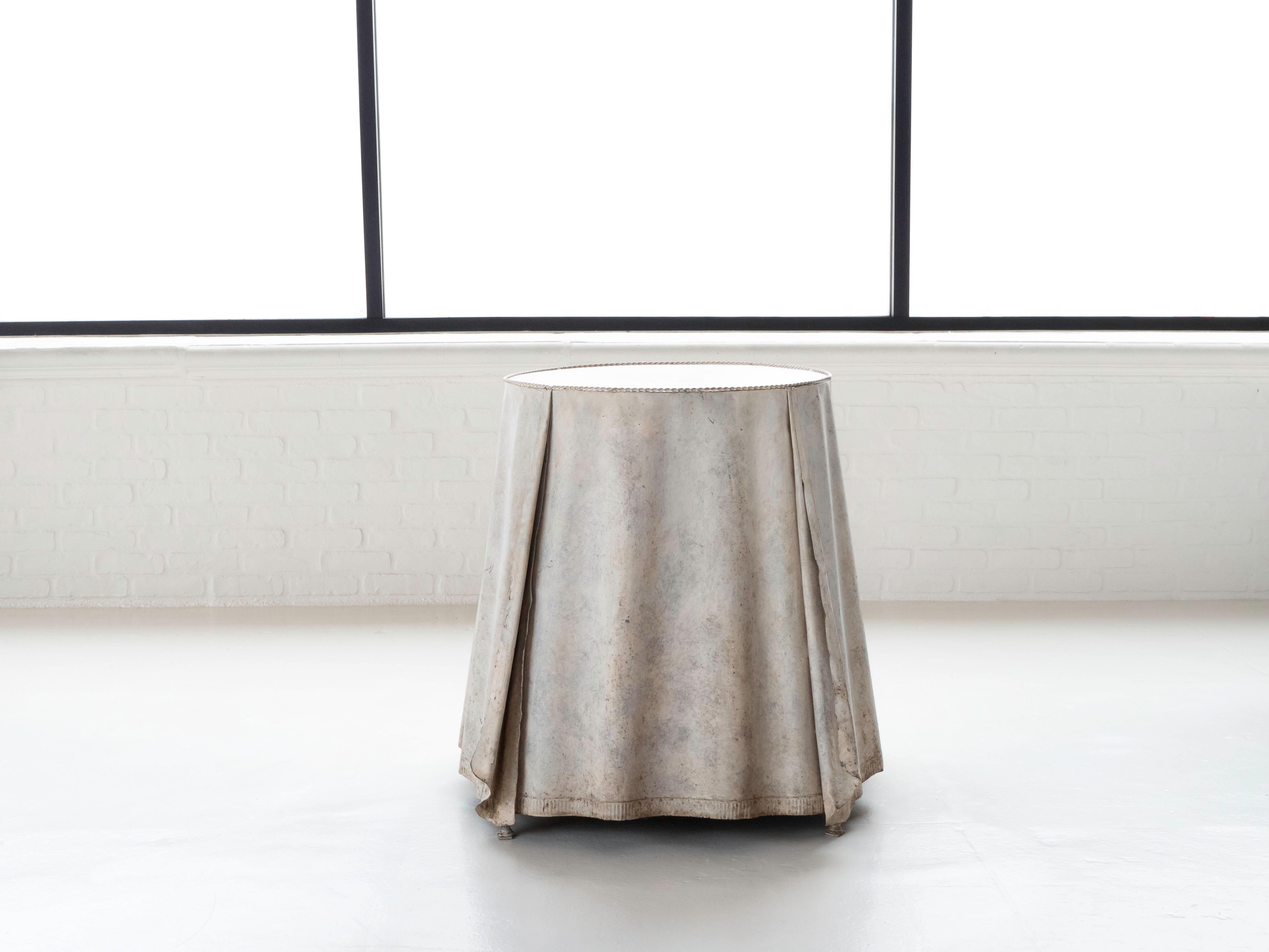 Stunning galvanized steel draped trompe l'oeil occasional table. Made in Italy, circa 1950's/1960's. The table shows oxidation from age and use. The table is structurally sound and retains all original hardware and patina. Very reminiscent of