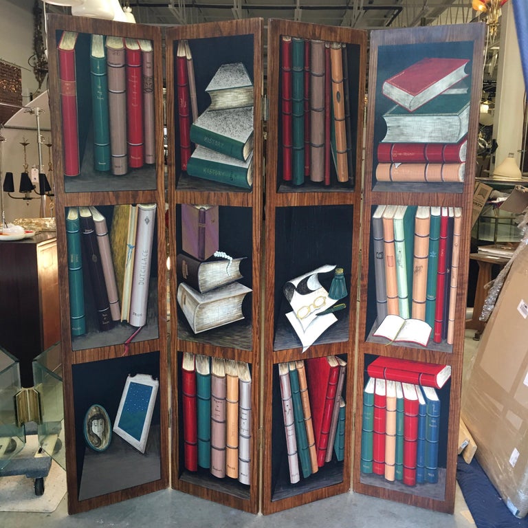 For the library, trompe l'oeil four-panel paravent with painted books on one inch thick solid oak. 72 inches high and each of the four 16 inch panels fold flat for ease of transport.